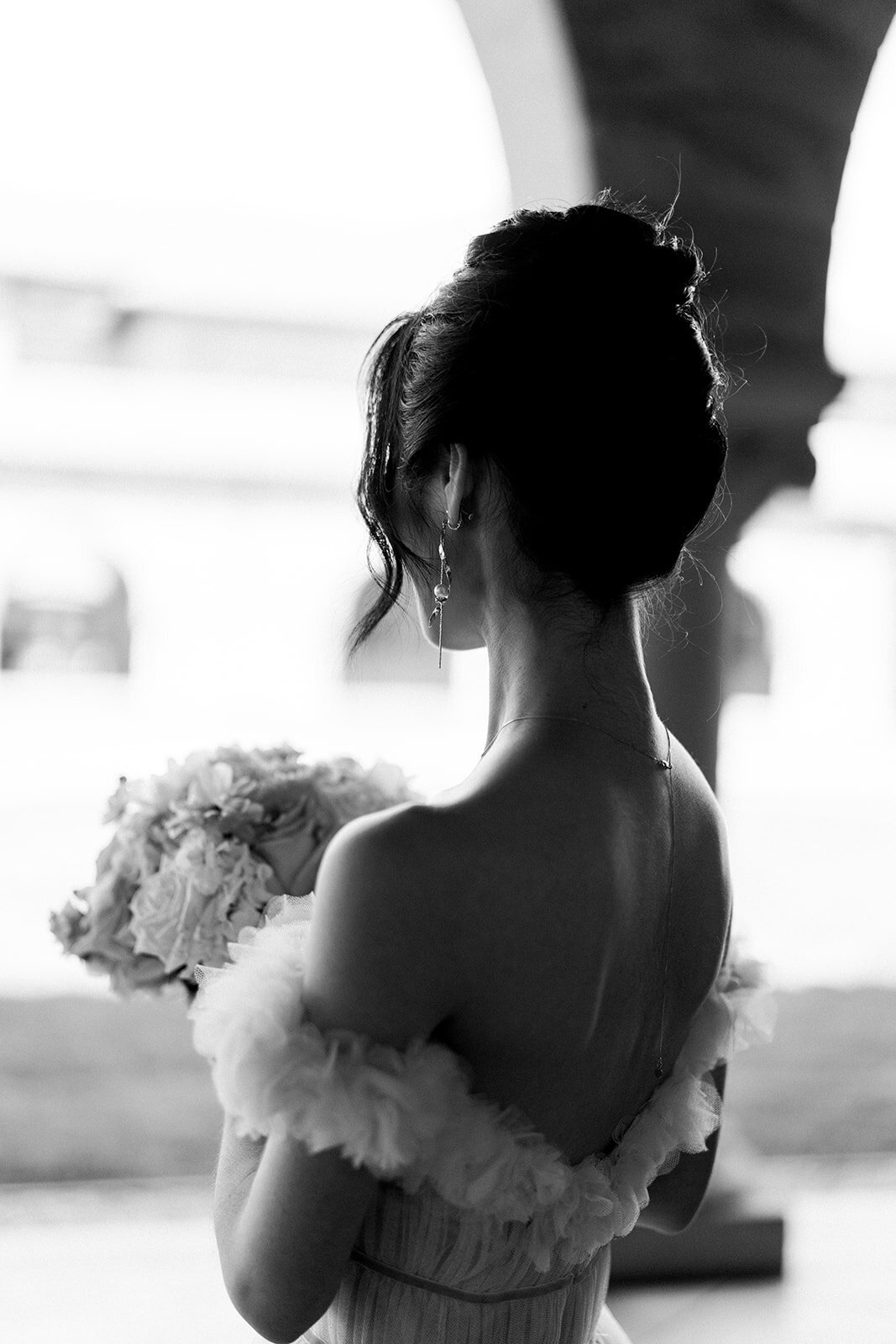 A timeless black and white portrait of the bride, capturing her elegance on her wedding day at Stanford Memorial Church in California.