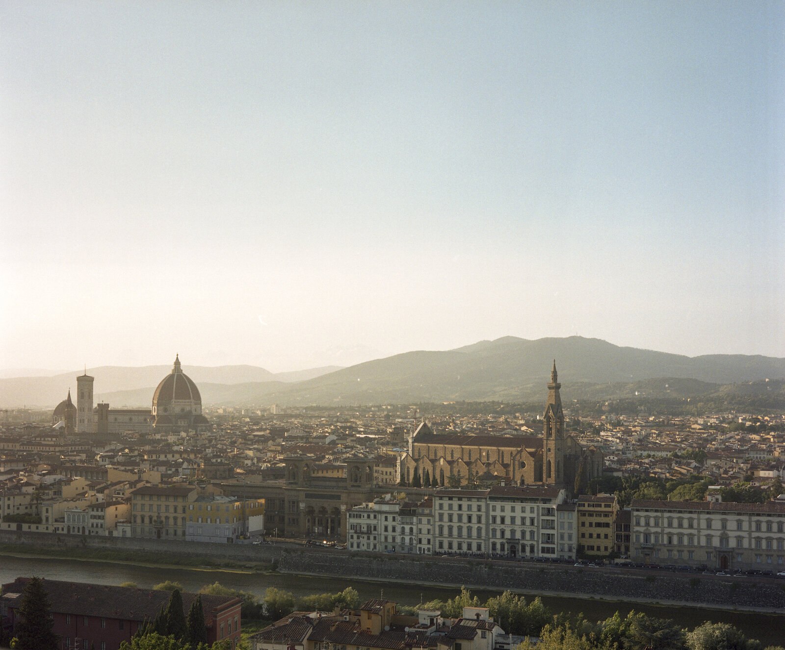 A picture of the city of Florence with Duomo in the background