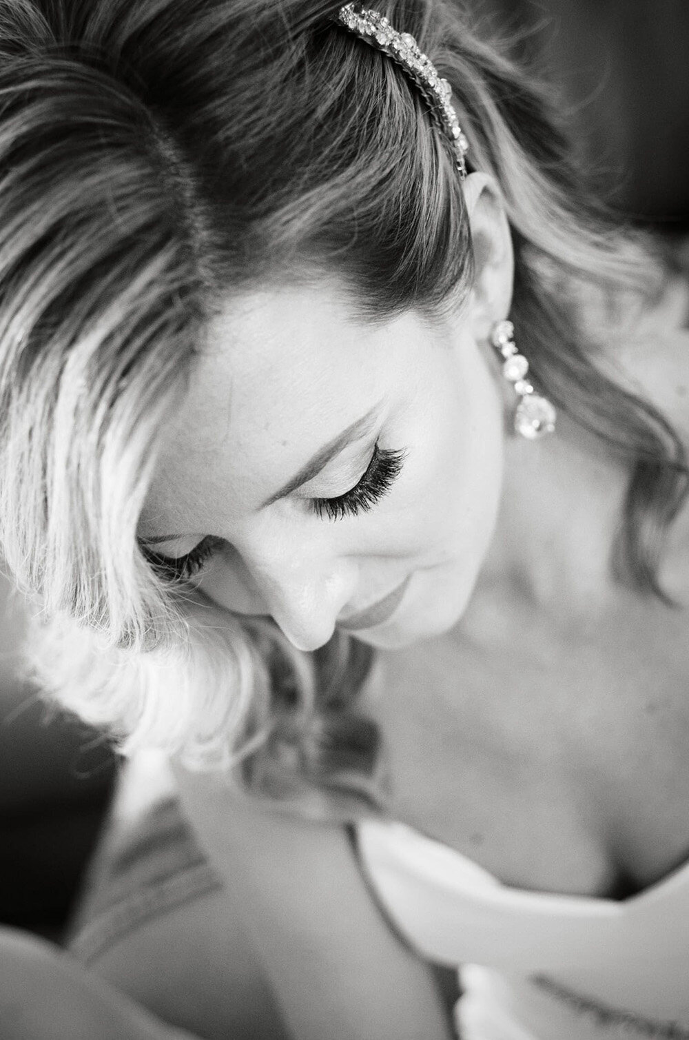 black and white of bride from above with focus on lashes