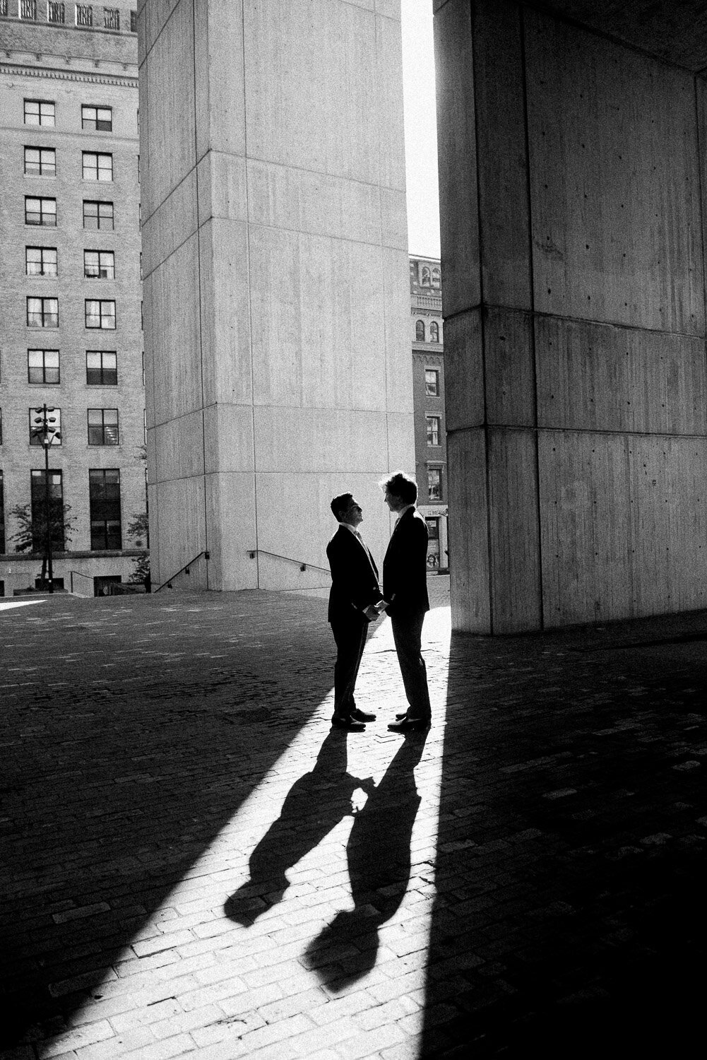 grooms silhouette and shadow with buildings