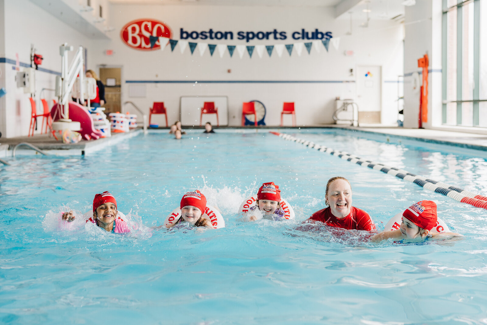 swim teacher with students at boston sports club pool