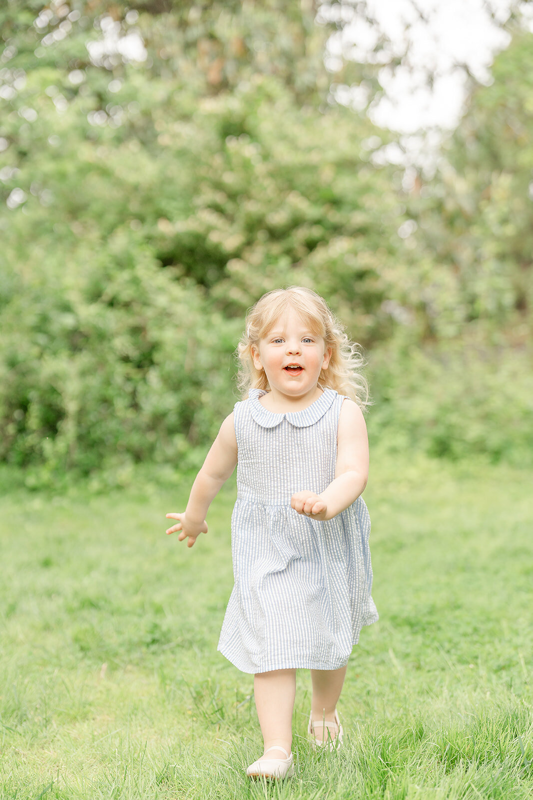 big sister running in the backyard