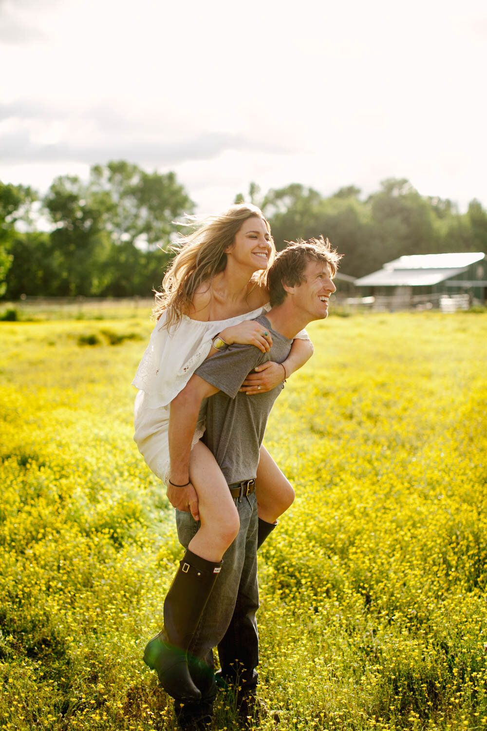 engaged couple flower field