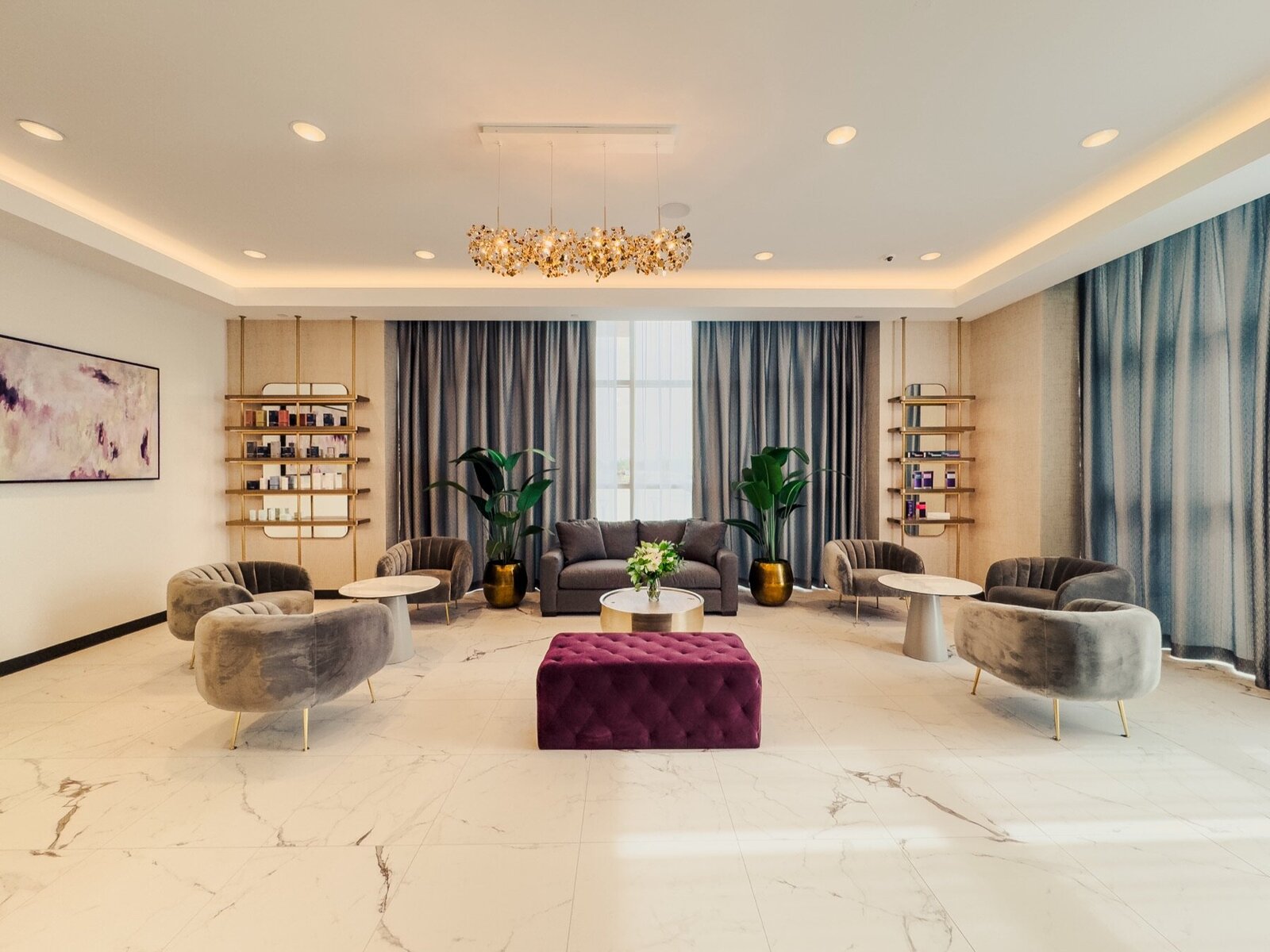 Lounge at MyEvergreen MedSpa with marble floors and a chandelier
