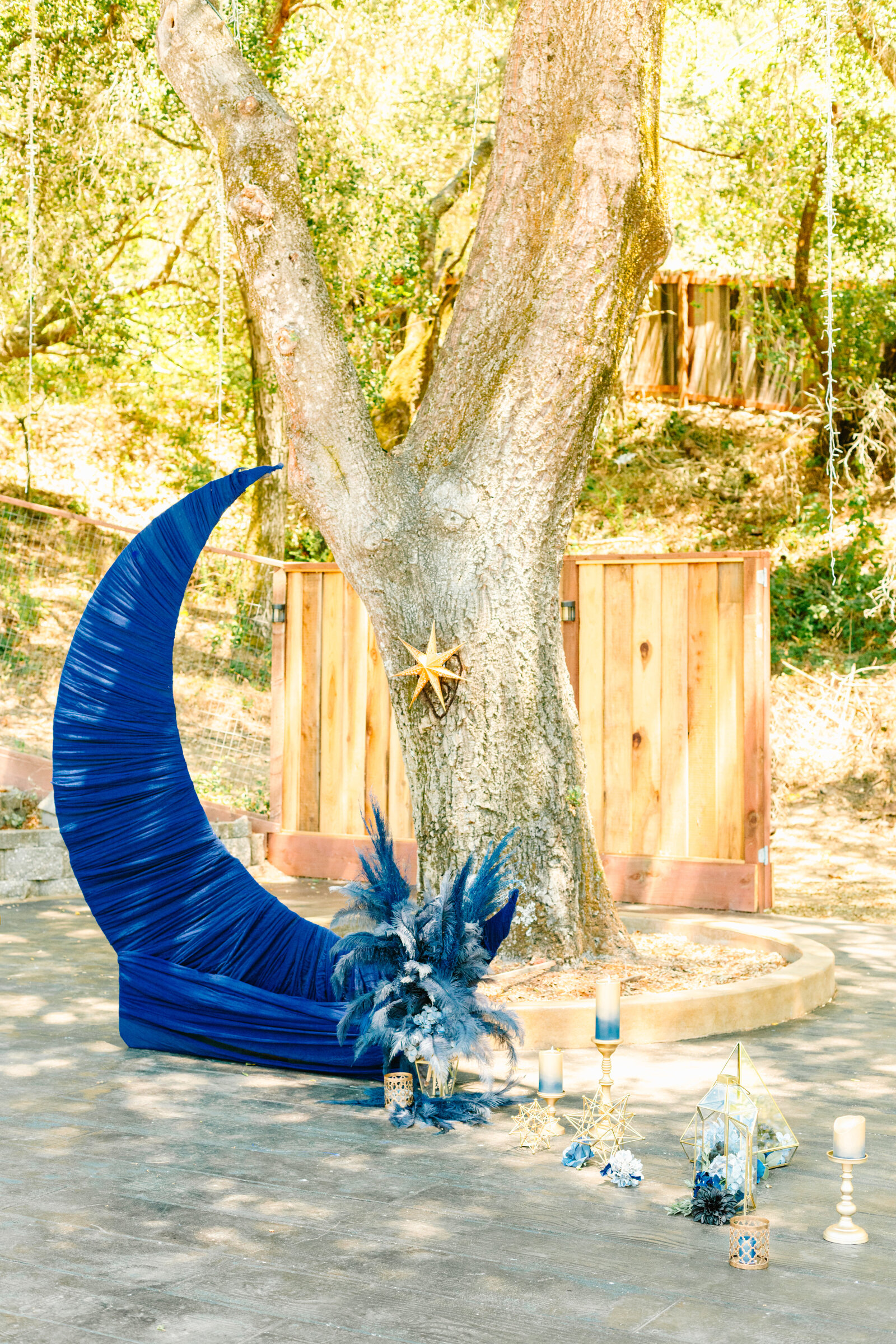 Night under the stars wedding decor with a moon cutout.