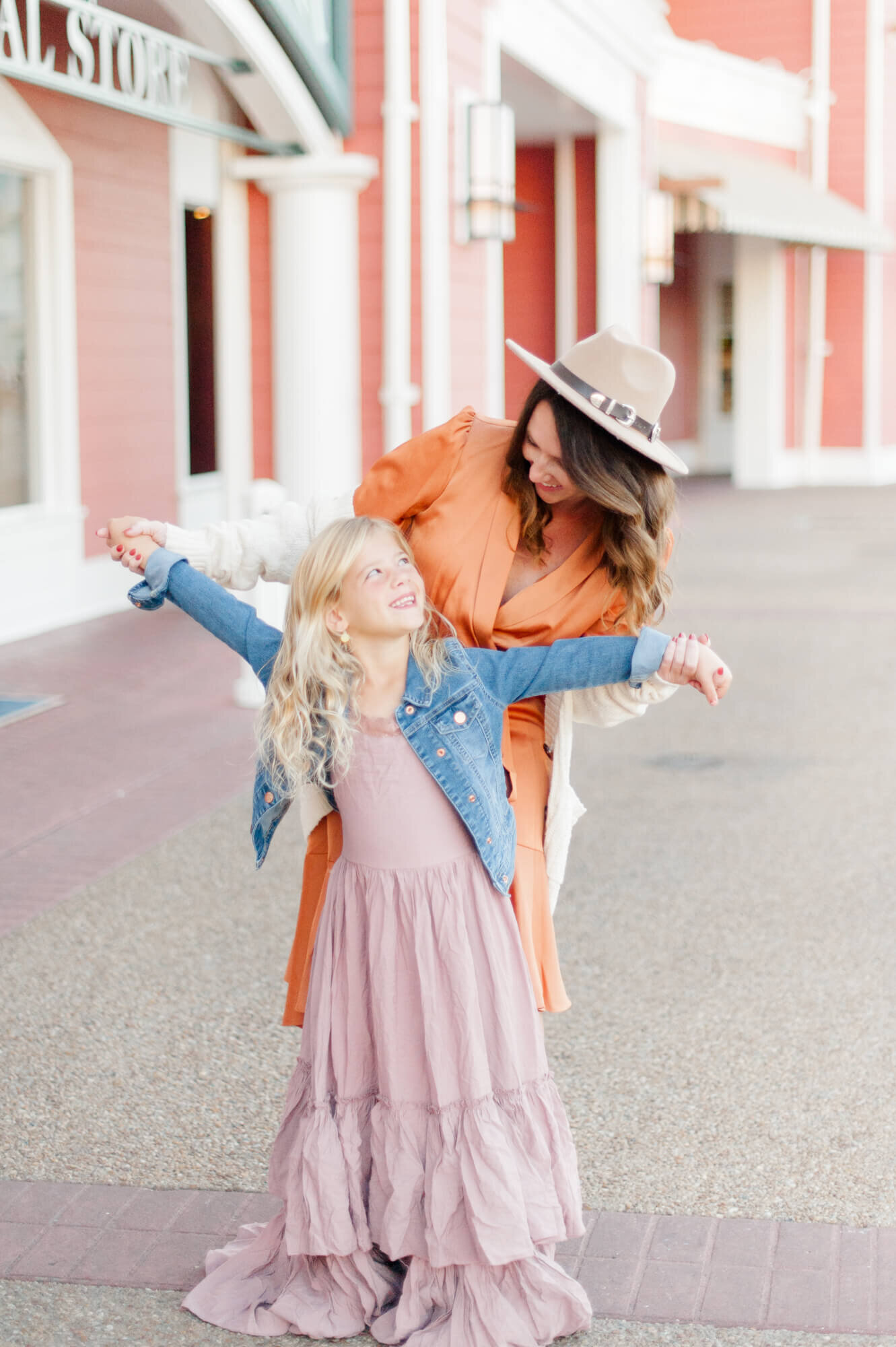 Mom and daughter dancing during their Orlando family photography session