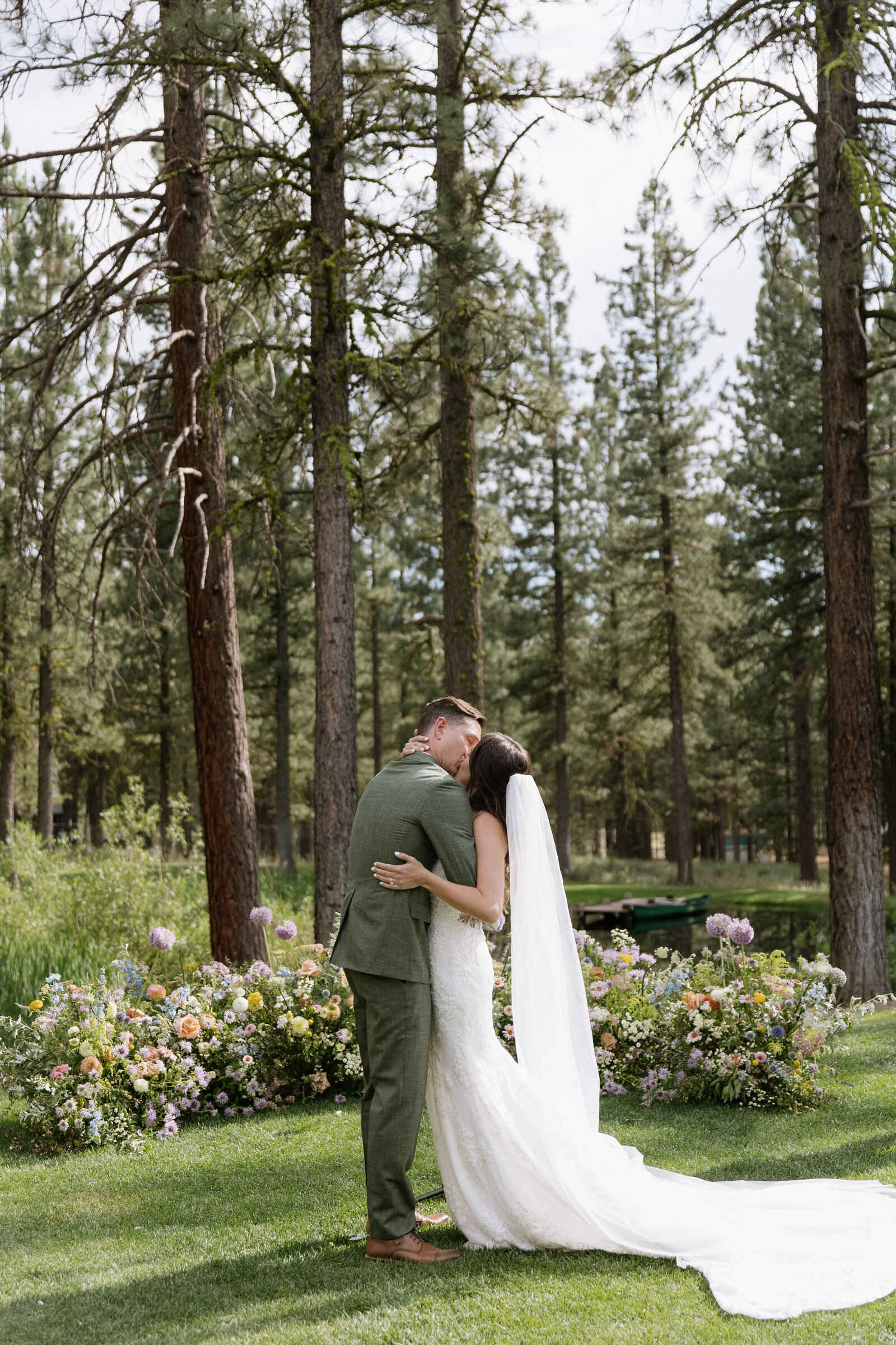 Bride and groom kissing after ceremony in Lake Tahoe woods