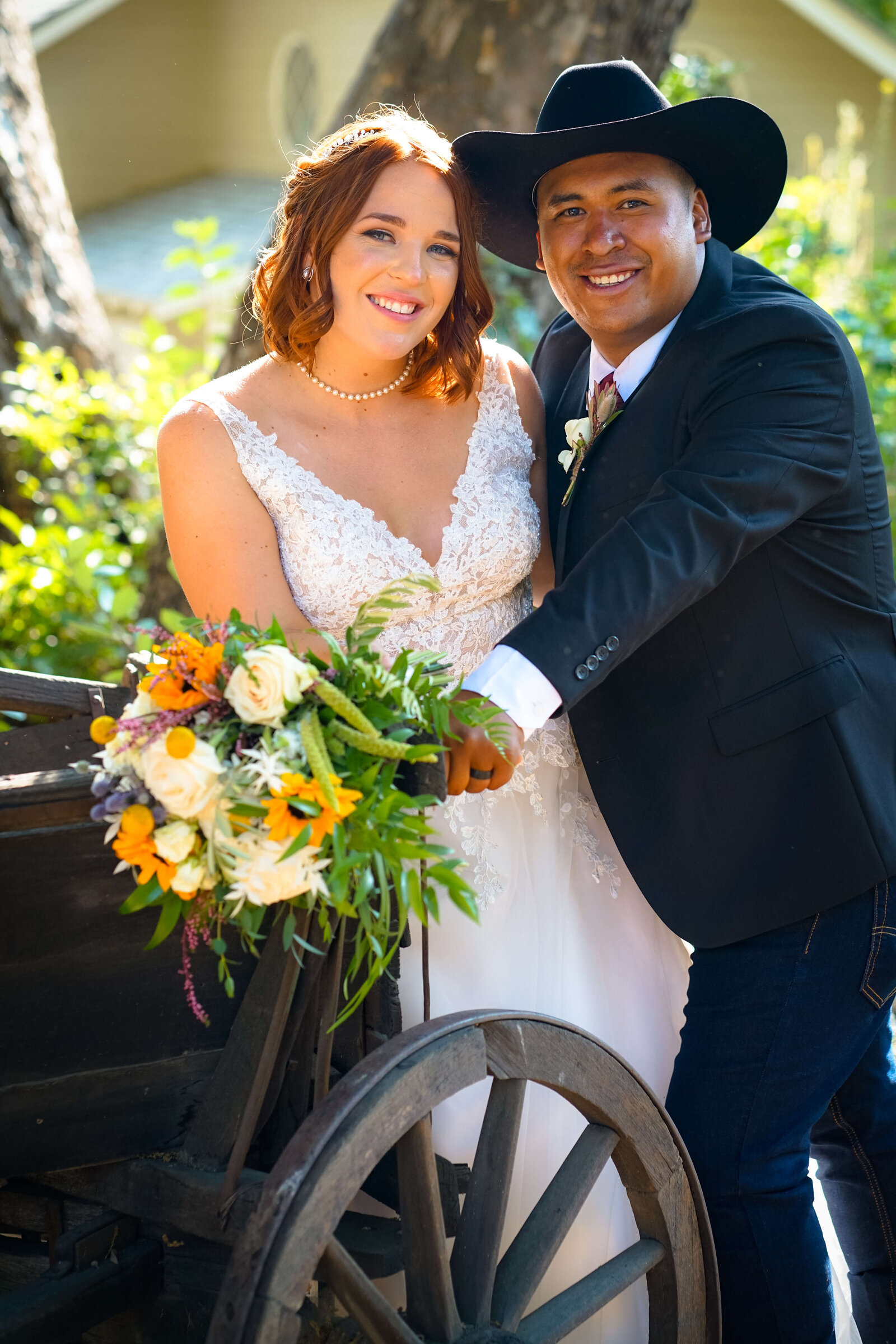 Newport Beach Wedding Photographer groom wearing cowboy hate and bride holding yellow bouquet