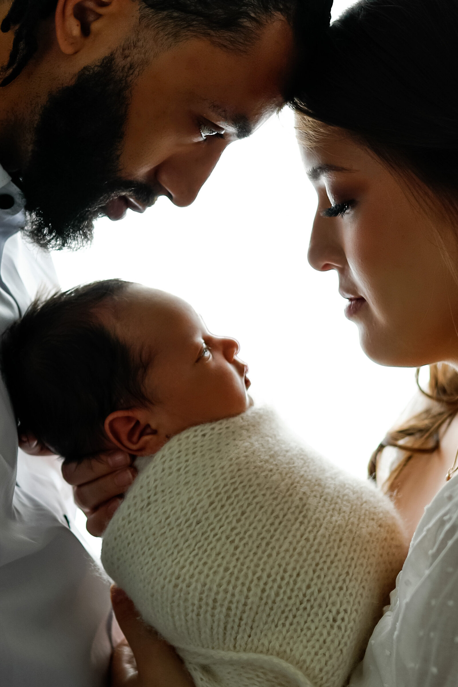 backlit-family-with-newborn-first-time-parents-high-key-Olivia-Acton-Photography-Janesville