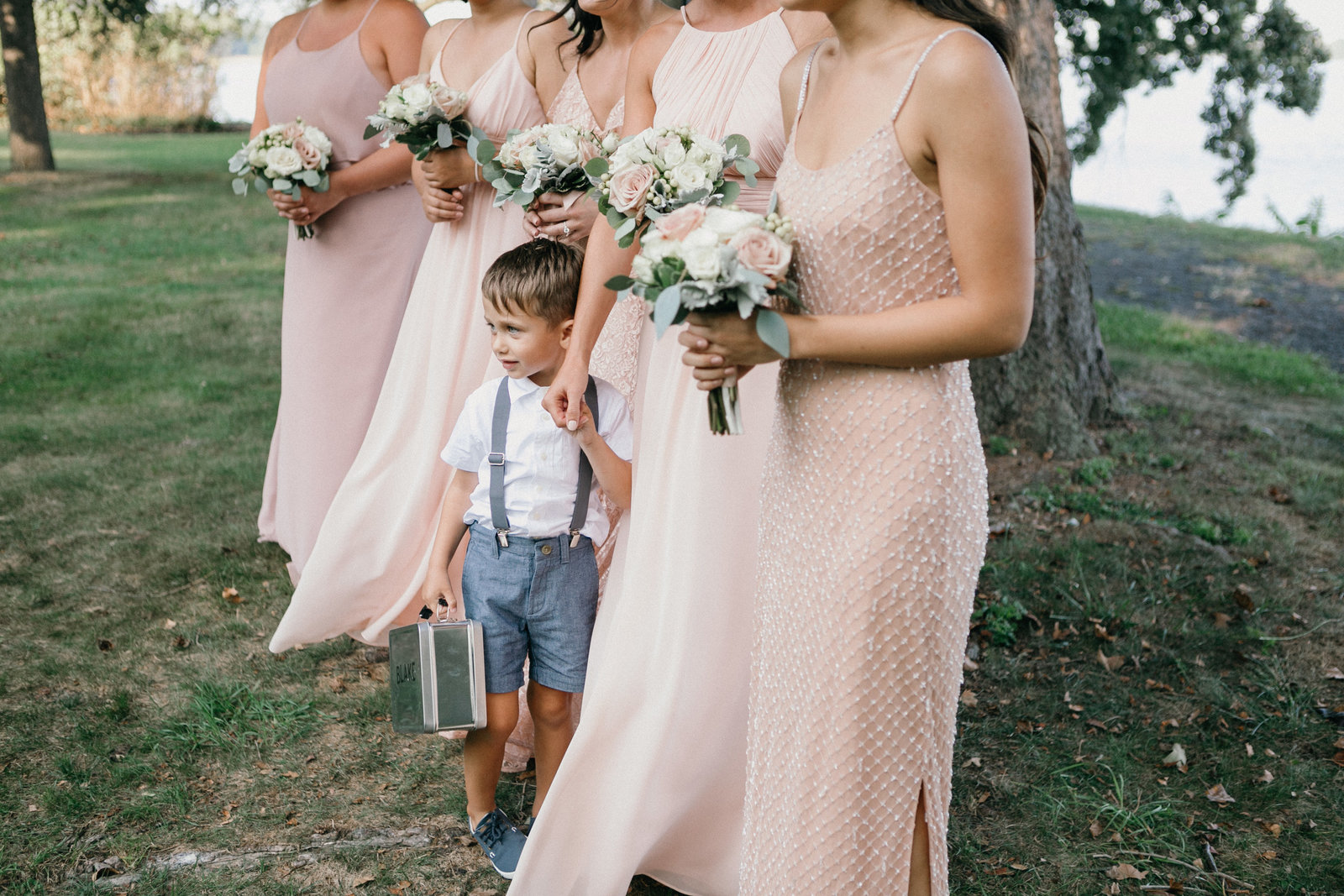 Cutest ring bearer photographed with the bridesmaids during this outdoor wedding ceremony at Glen Foerd.