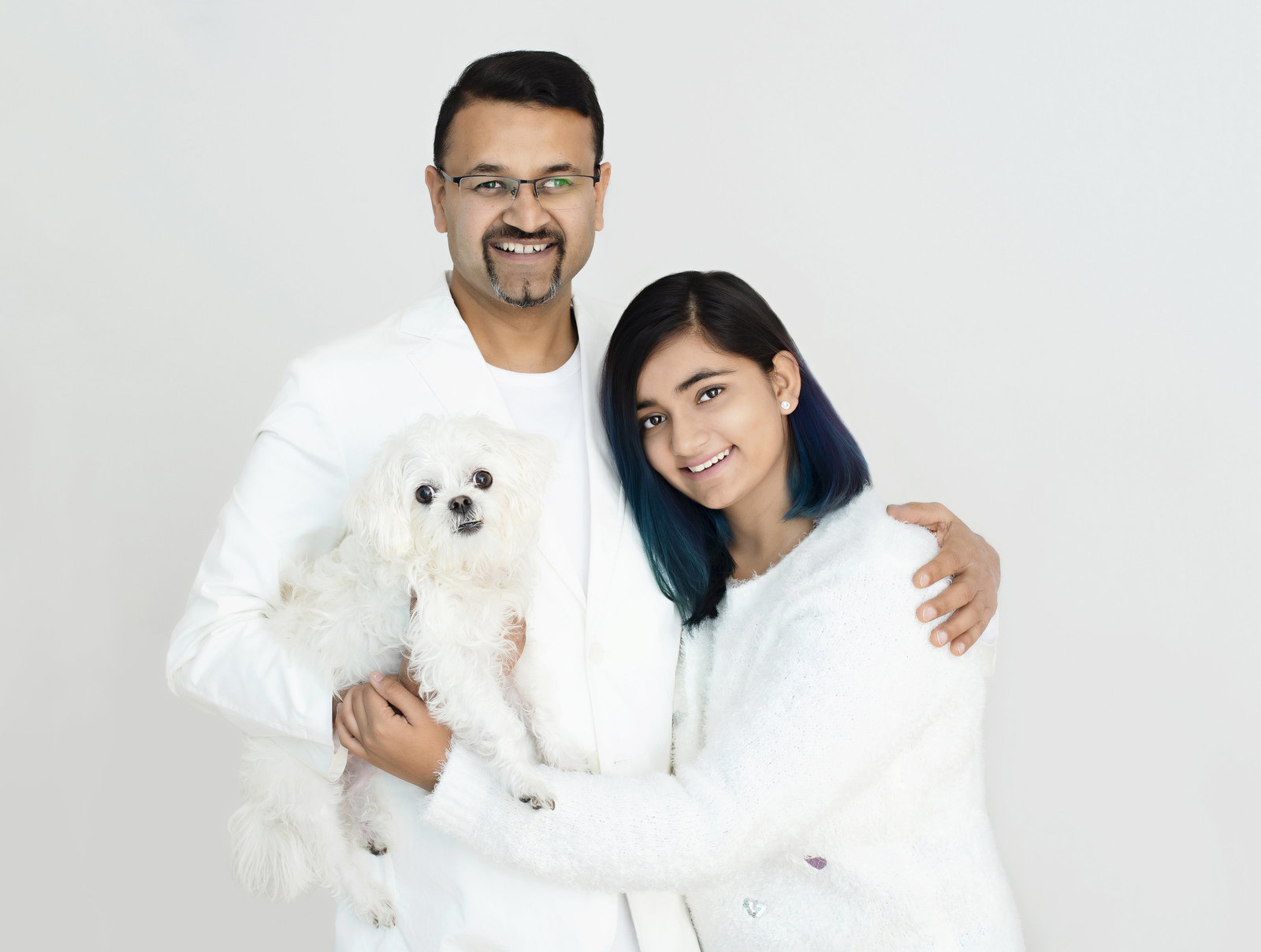 Brand photographer - father and  daughter posing for  portrait during family photography session  and  with  holding their  pet dog in hand ng, Headshots, Makeover Photoshoots in Mississauga, Oakville, Milton, Burlington, Toronto, GTA