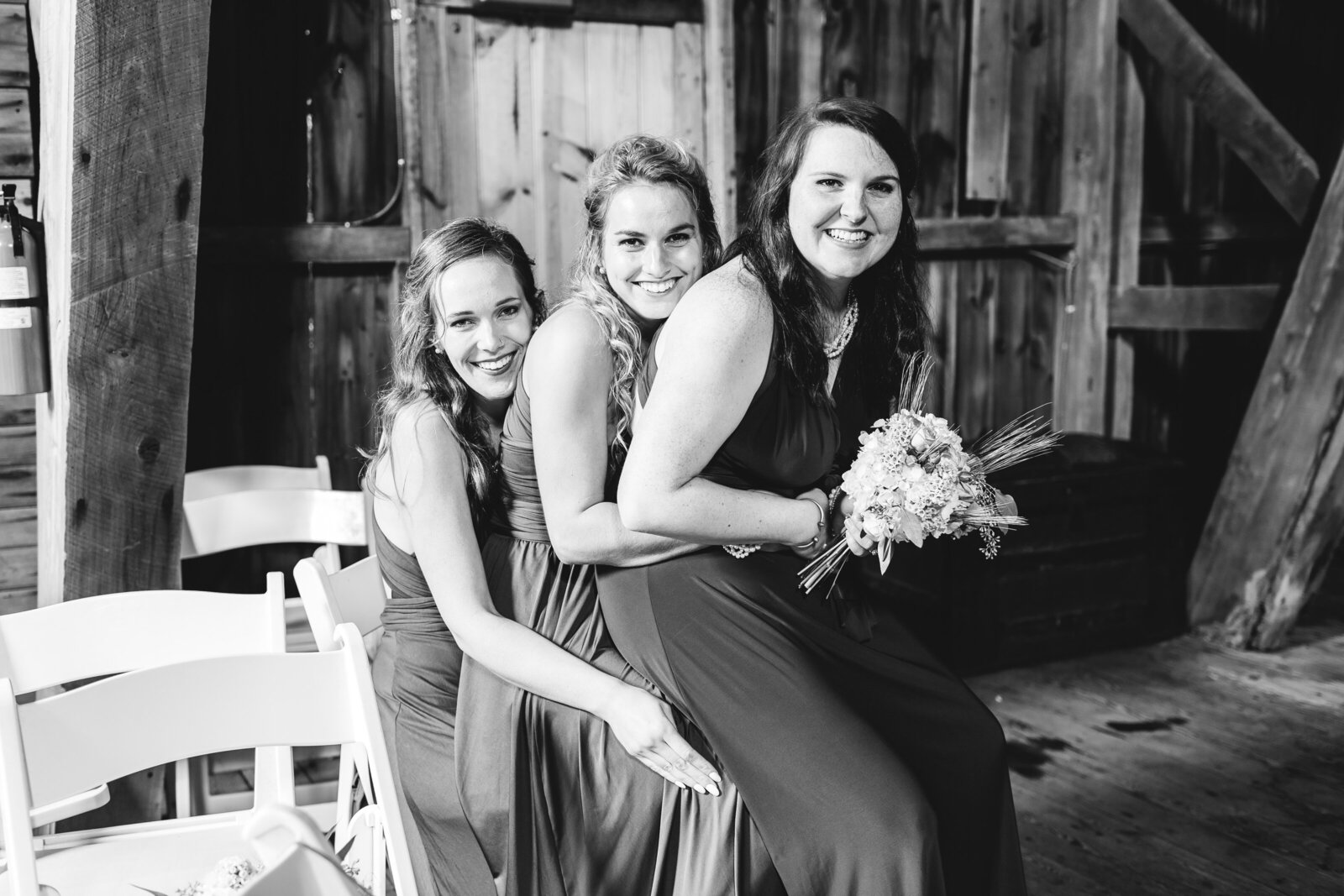 bridesmaids-sitting-fall-wedding-barn