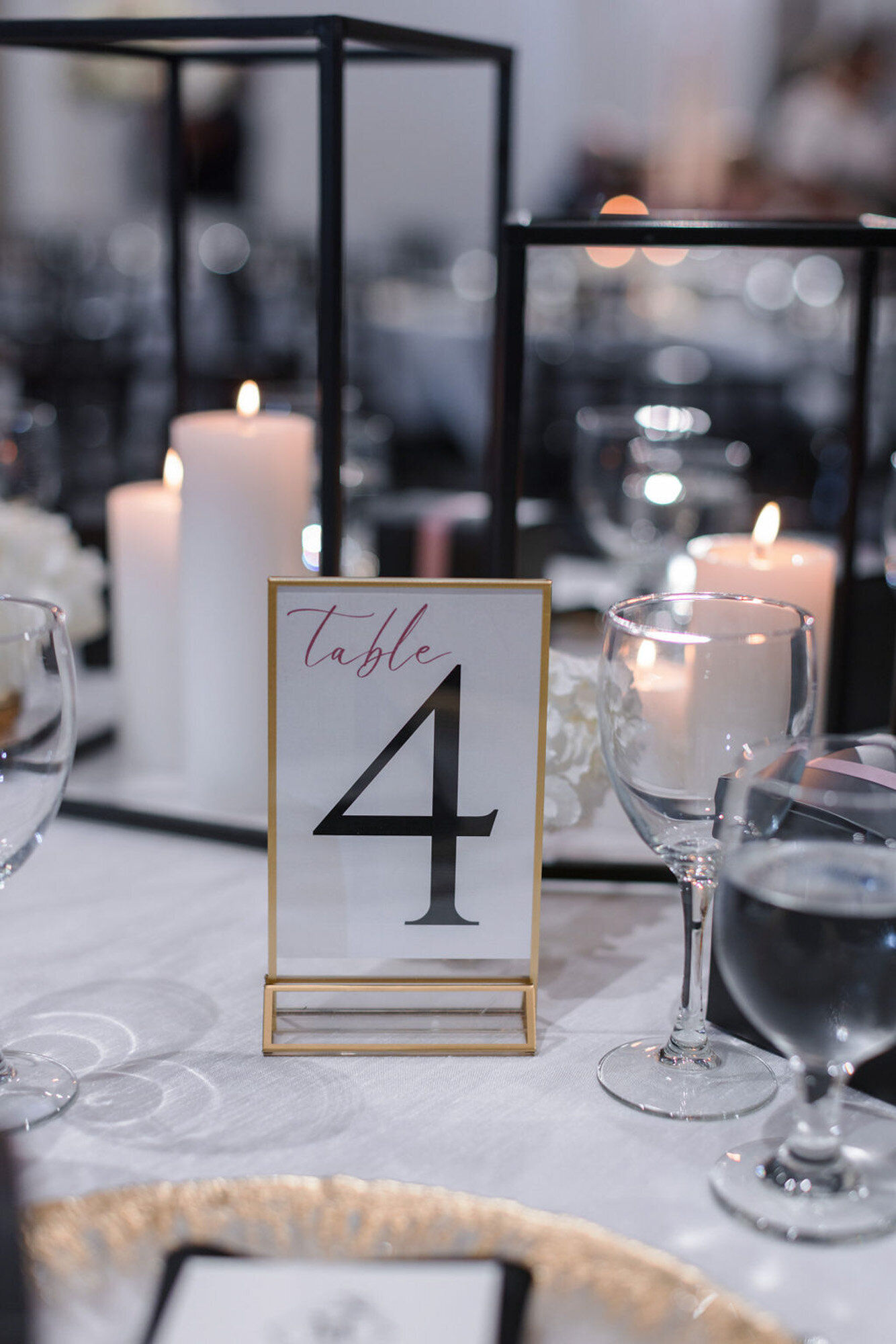 table four centerpiece with glasses and other luxury details