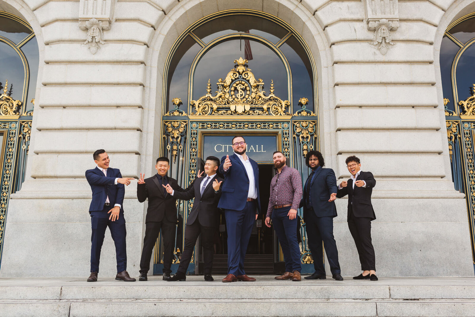 Groom and groomsment at San Francisco City Hall steps