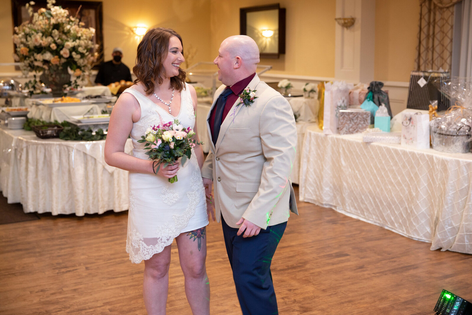 bride and groom looking intimately at each other on their wedding reception