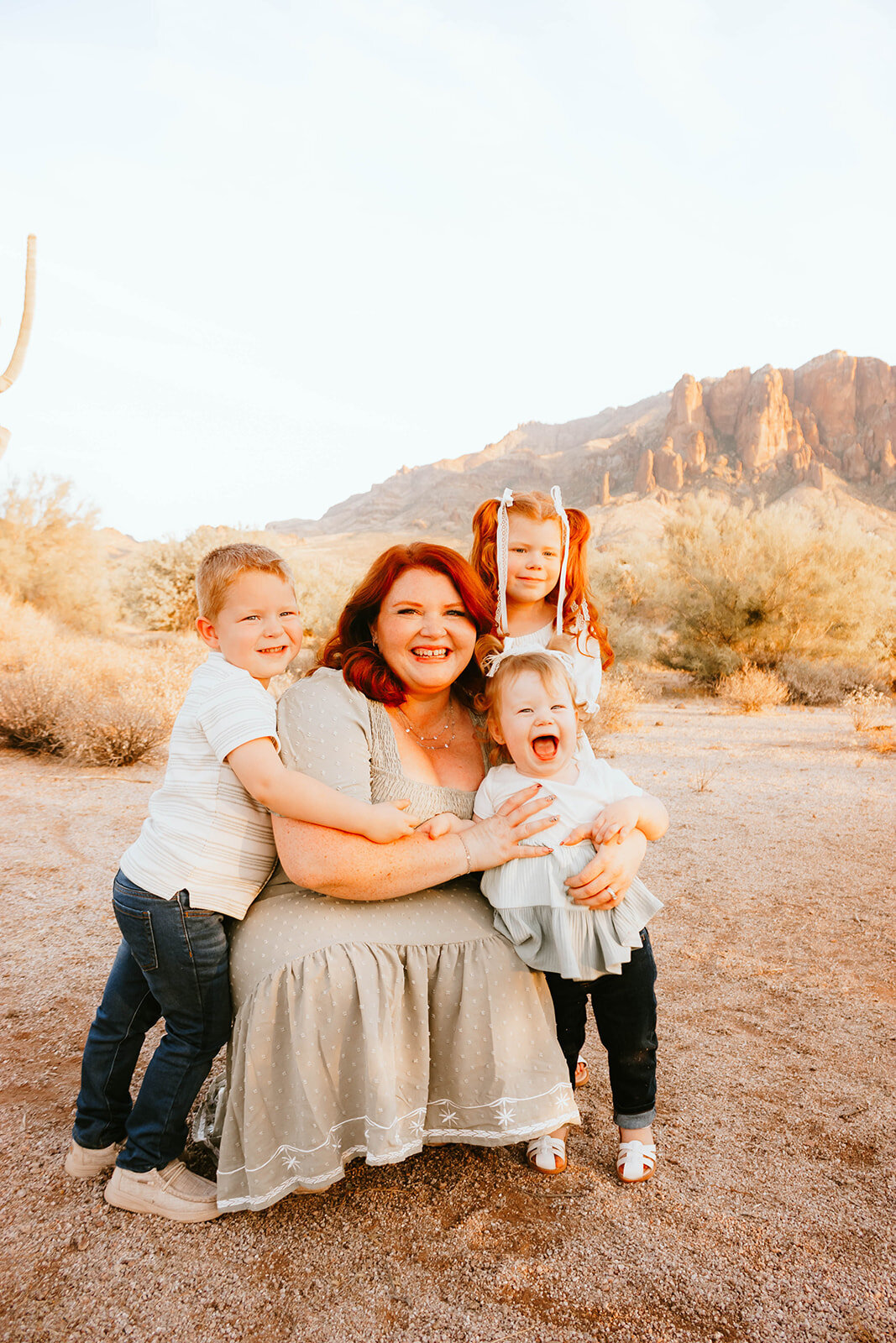 mom holding children