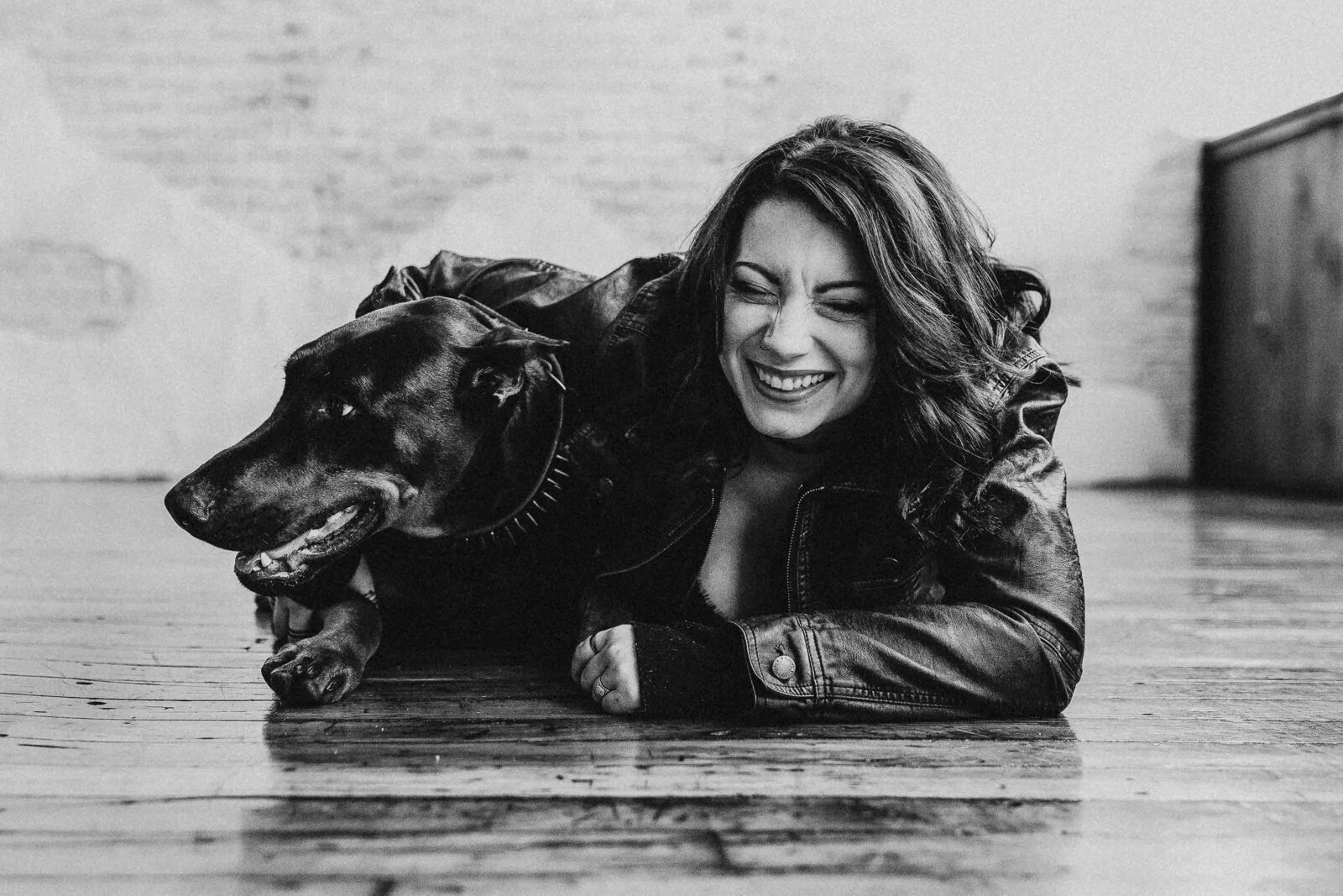 black and white photo of a woman and her dog
