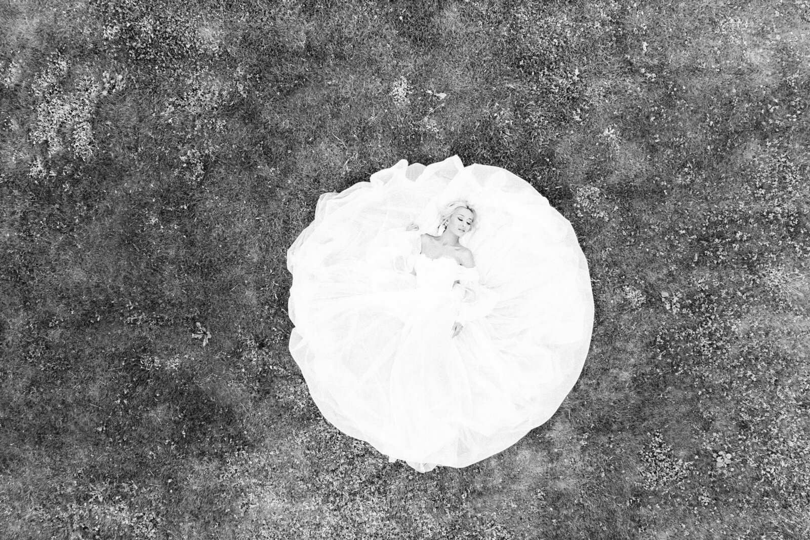 Drone shot of the bride overhead in a field in Arizona. 