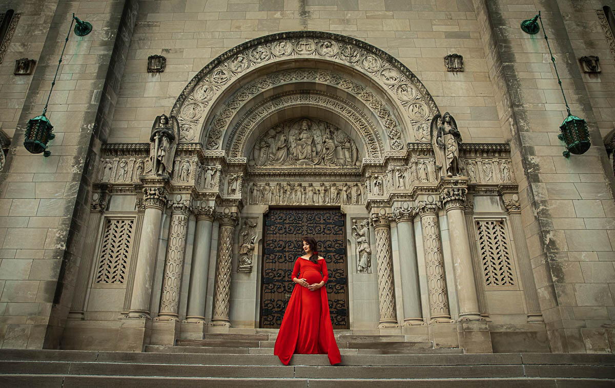 cathedral door with a pregnant lady in red dress