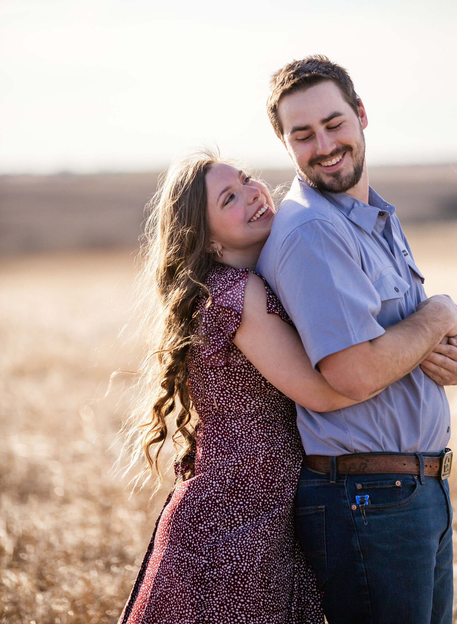 engaged couple embracing