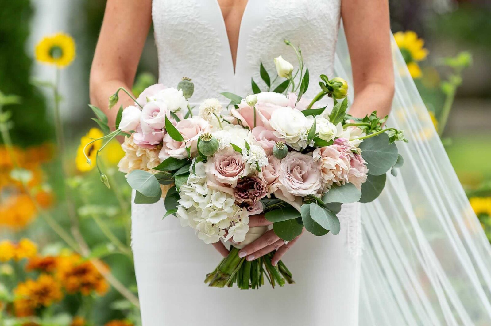 Anna Barnard Wedding - bride holding flowers