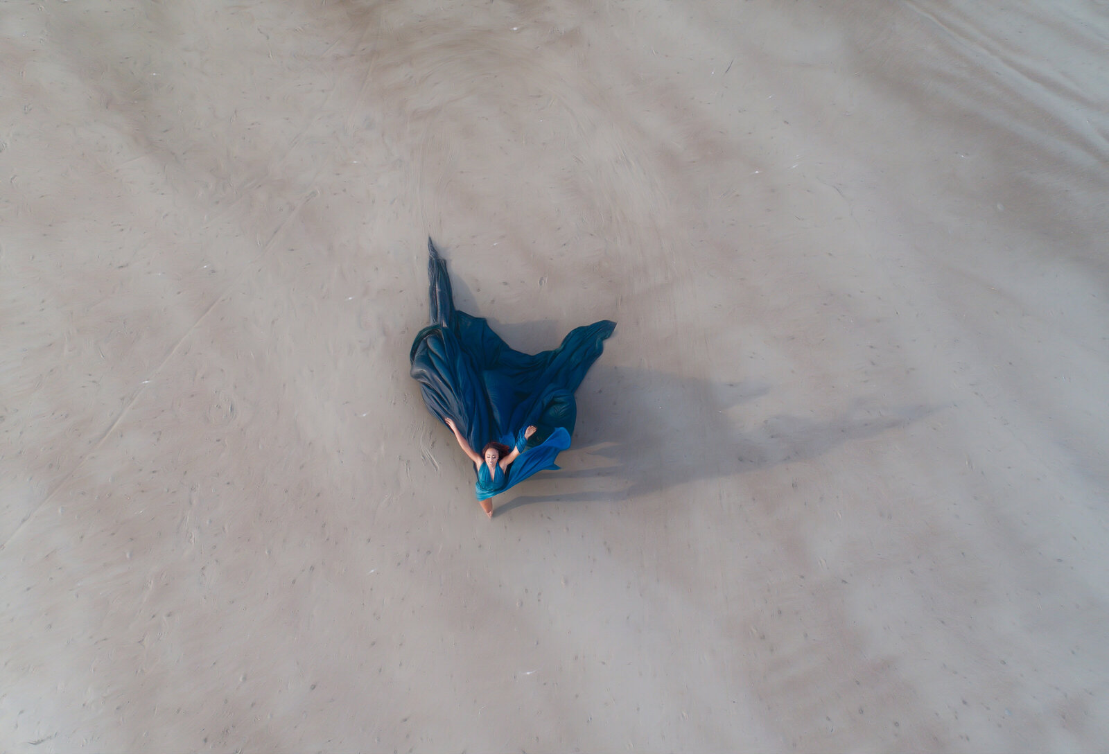 Savannah Georgia Boudoir and Glamour Woman in blue parachute gown on beach drone picture