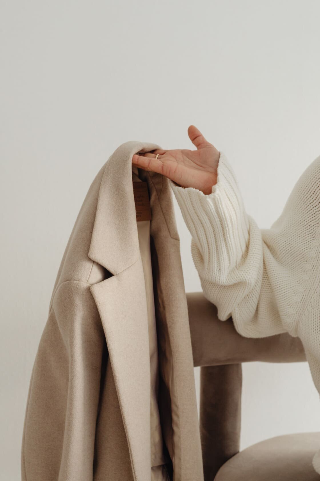 kaboompics_woman-in-white-sweater-beige-wool-jacket-29421