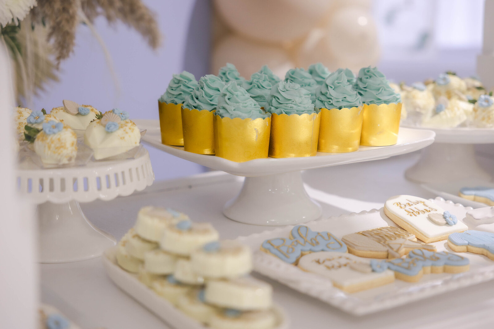 baby-shower-gold-cupcakes-and-themed-cookies