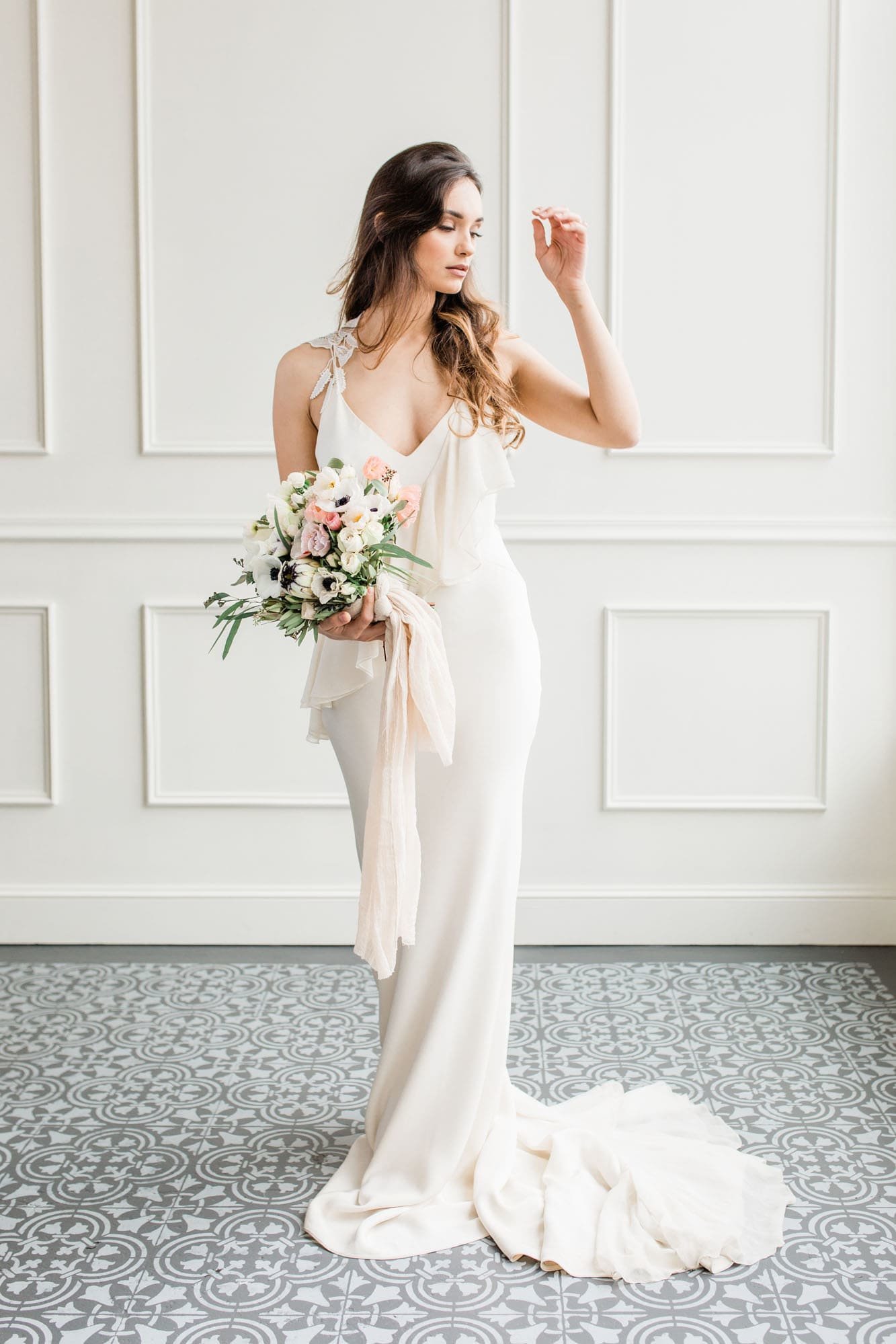 Unique wedding dress with ruffle detail and long train from Portland bridal boutique