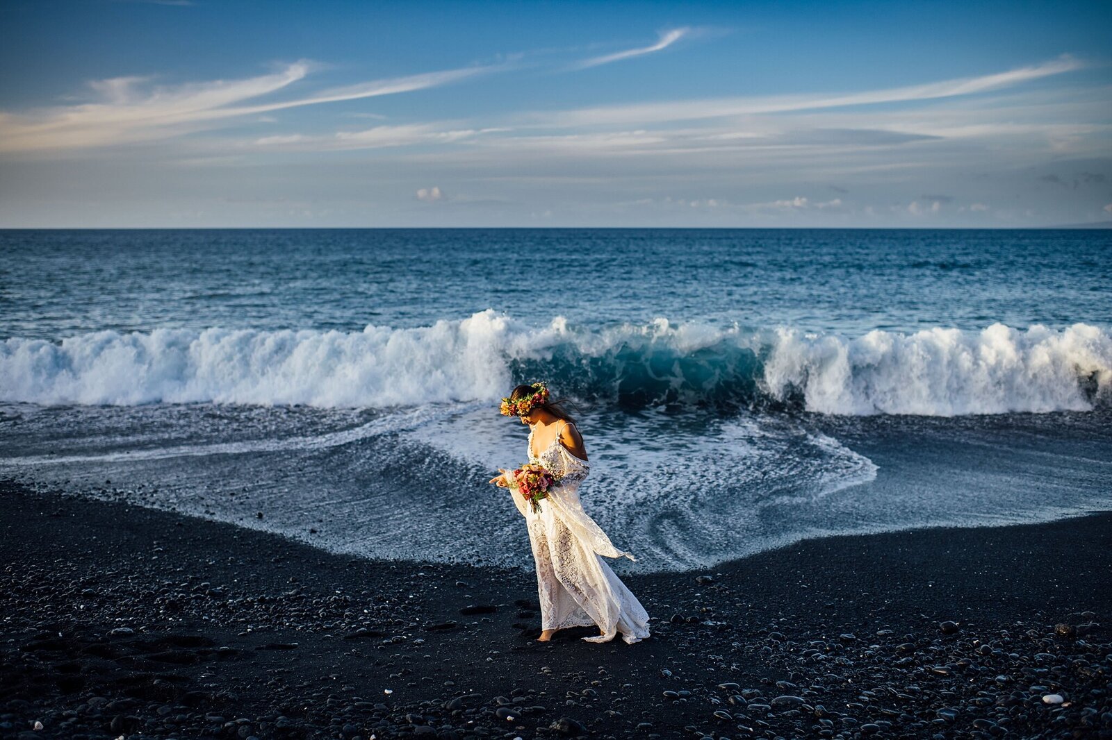 waves crashing behind bride on the big island