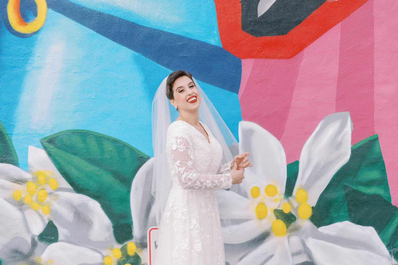 Bride with exterior painting at Outreach Event Space