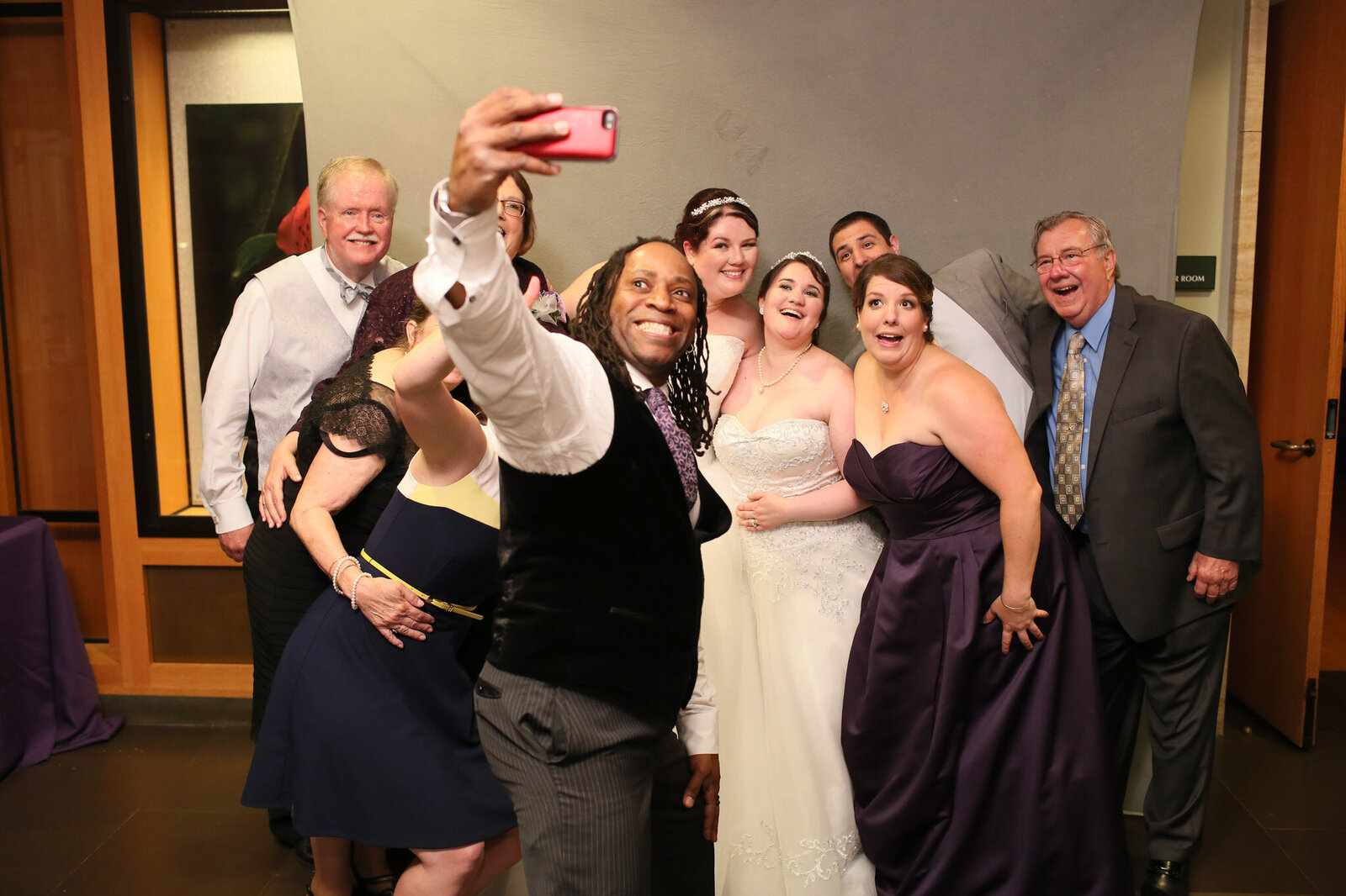 Bride and guests celebrating with DJ Jimmy from Charizma Entertainment at Chicago wedding