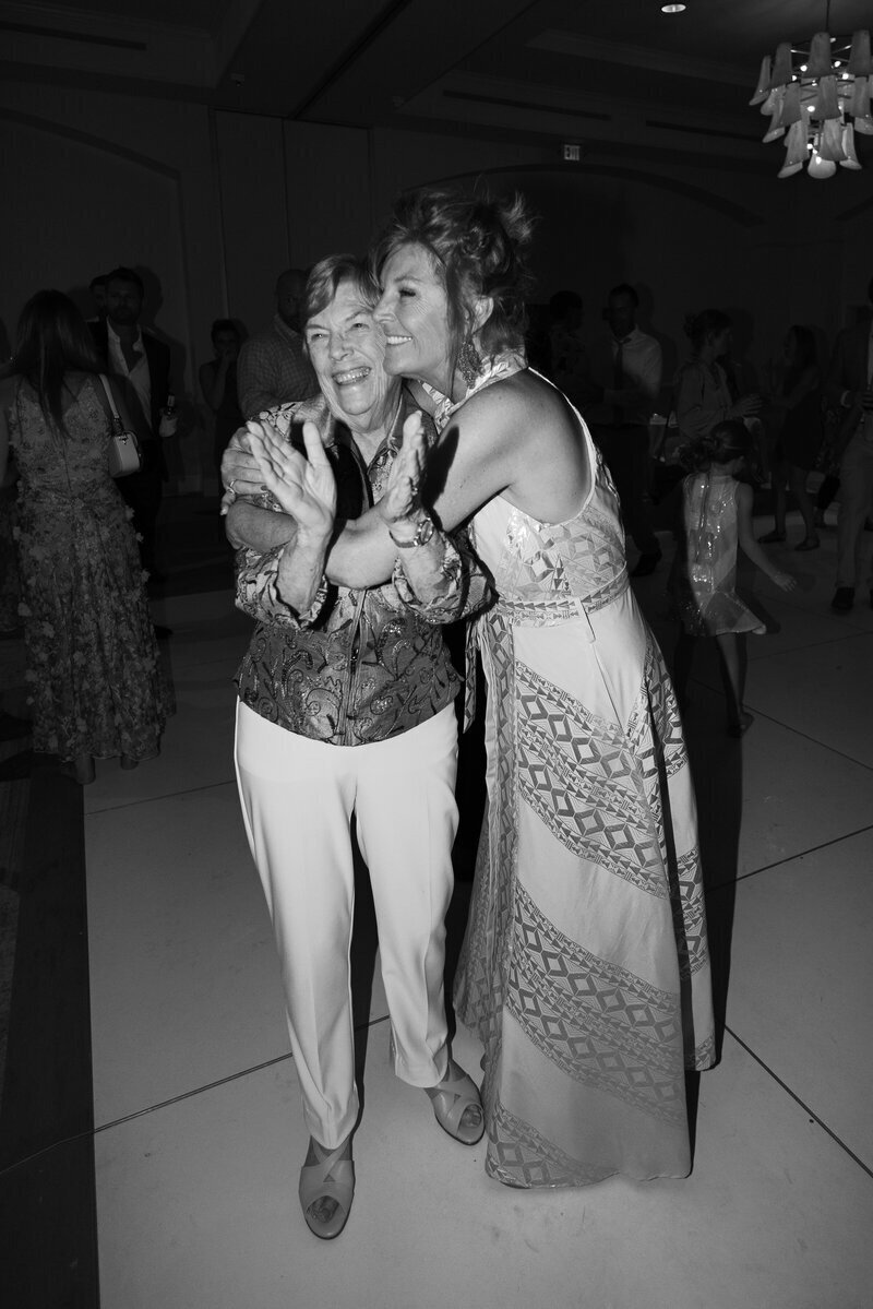 bride hugging her family member at fort myers florida wedding, photography by Veronica Costa