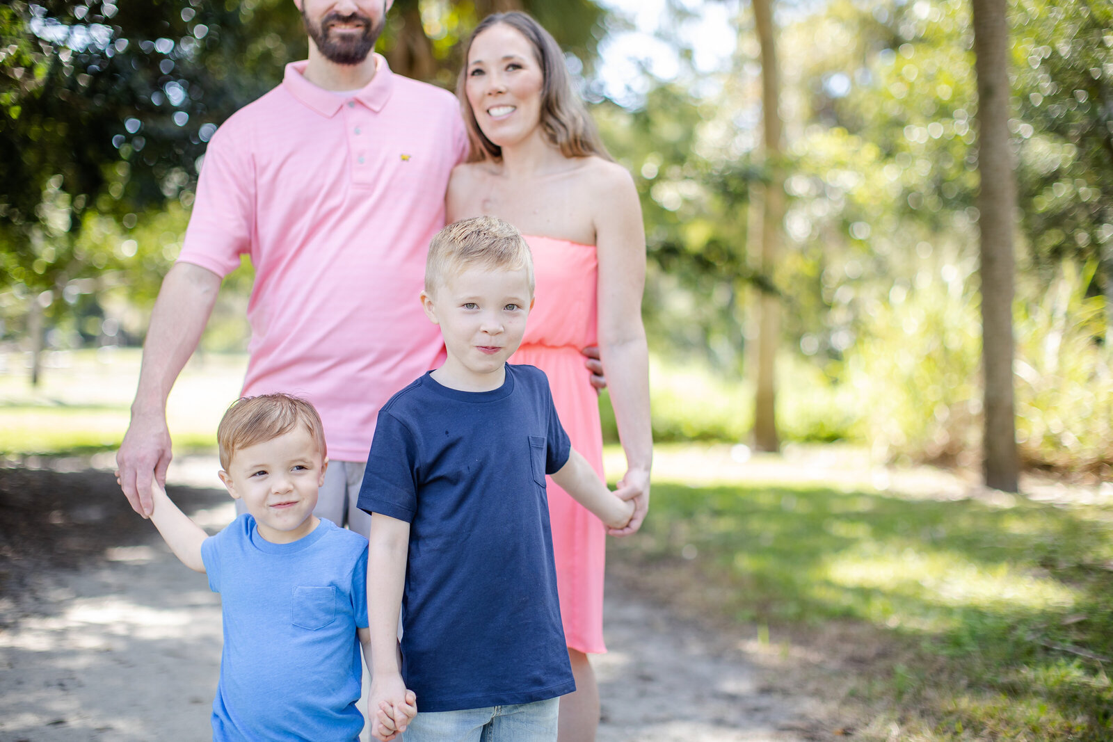 Micheal family poses for family portrait by RJP.