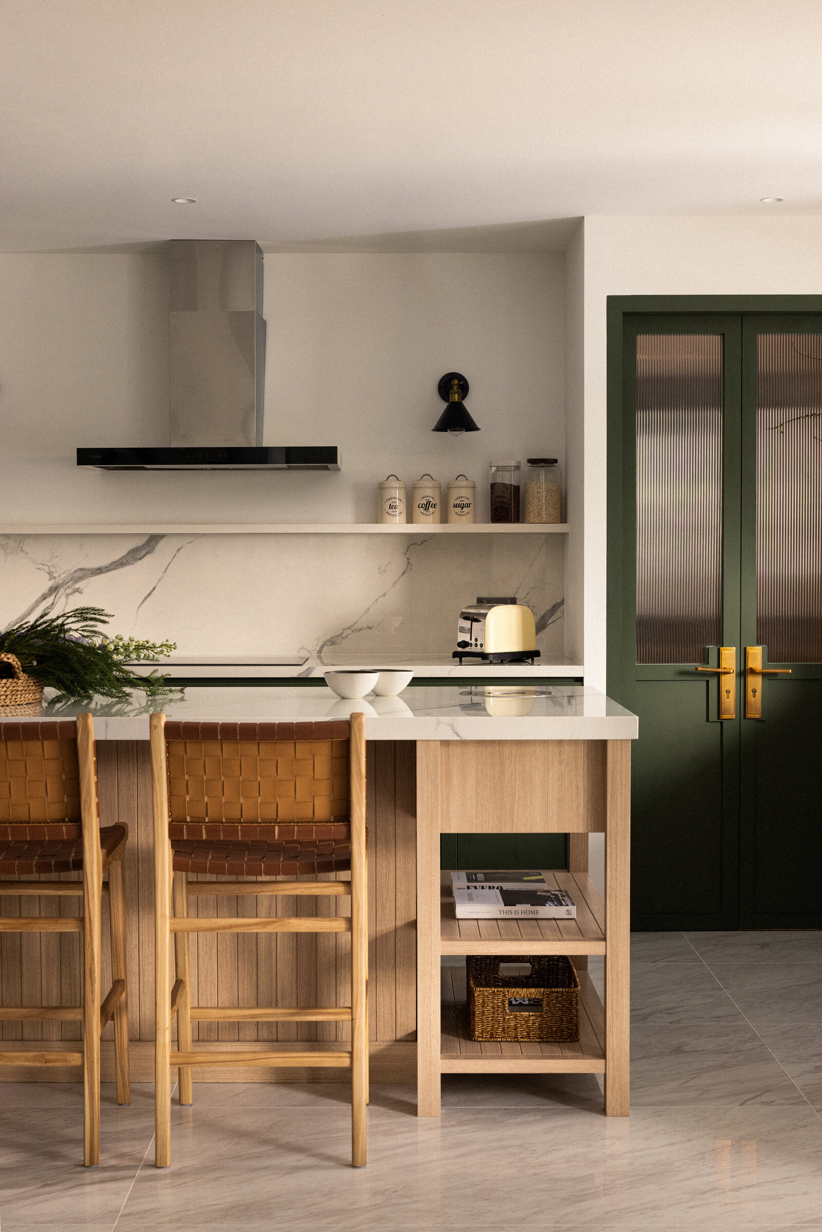 wide view of a kitchen with island and island stools