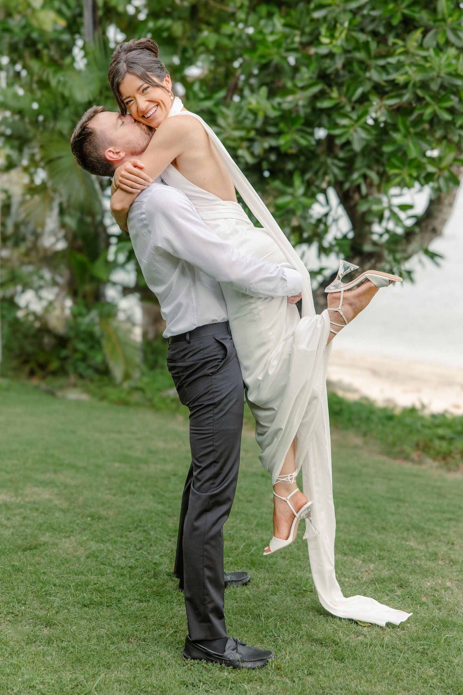 Groom lifting Bride up in the air