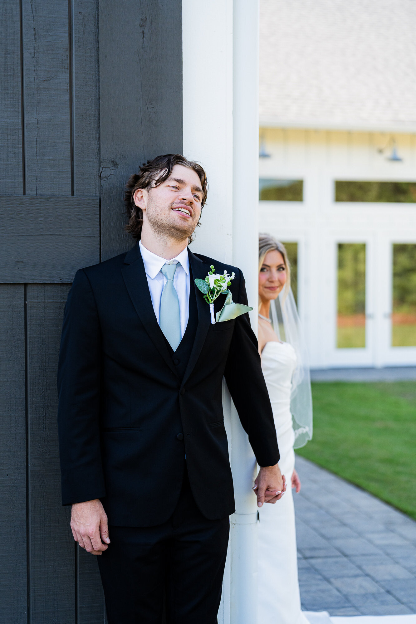 bride and groom visibly enjoying their first touch at this gorgeous Georgia wedding venue 