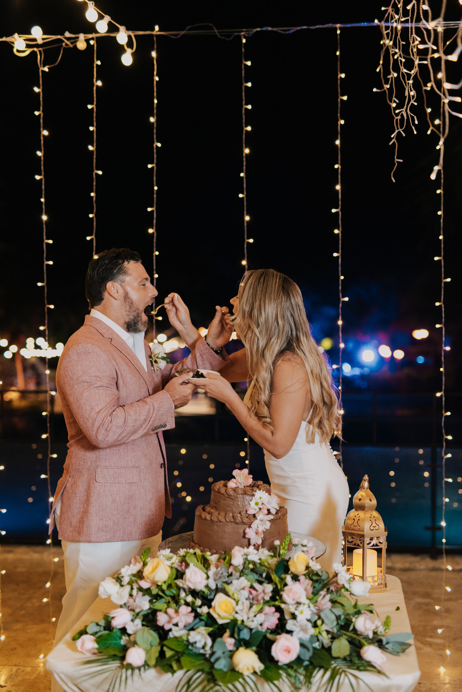 bride and groom eating wedding cake