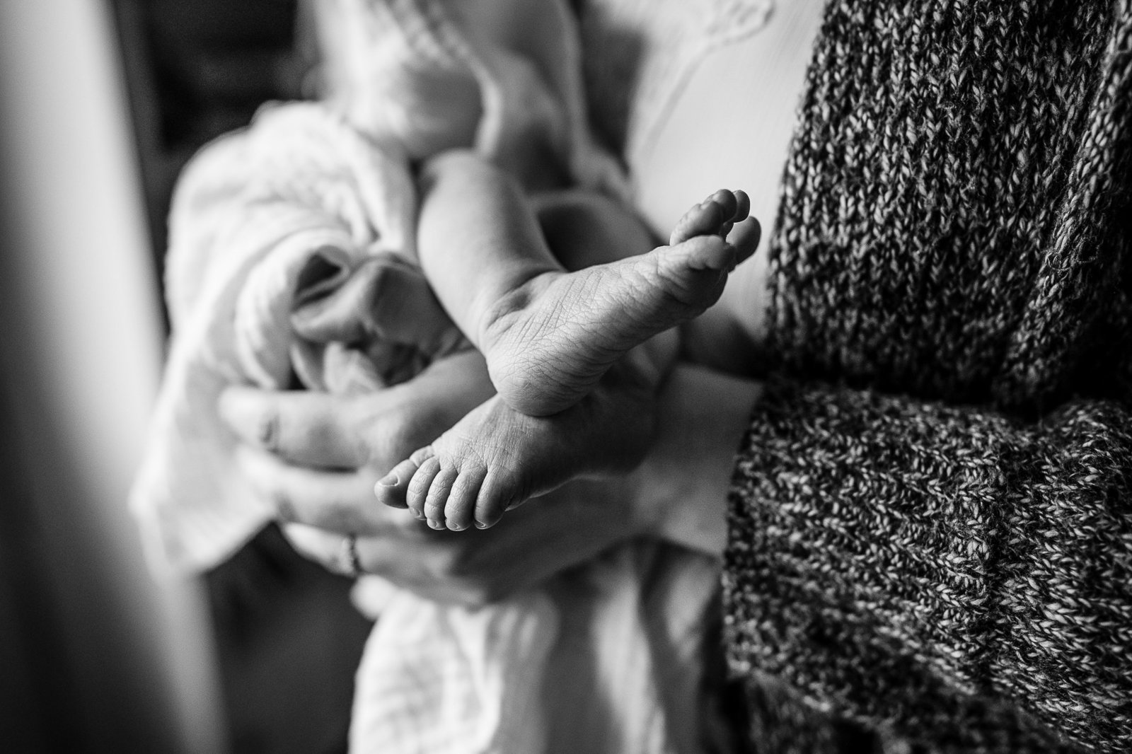 black and white image of newborn feet