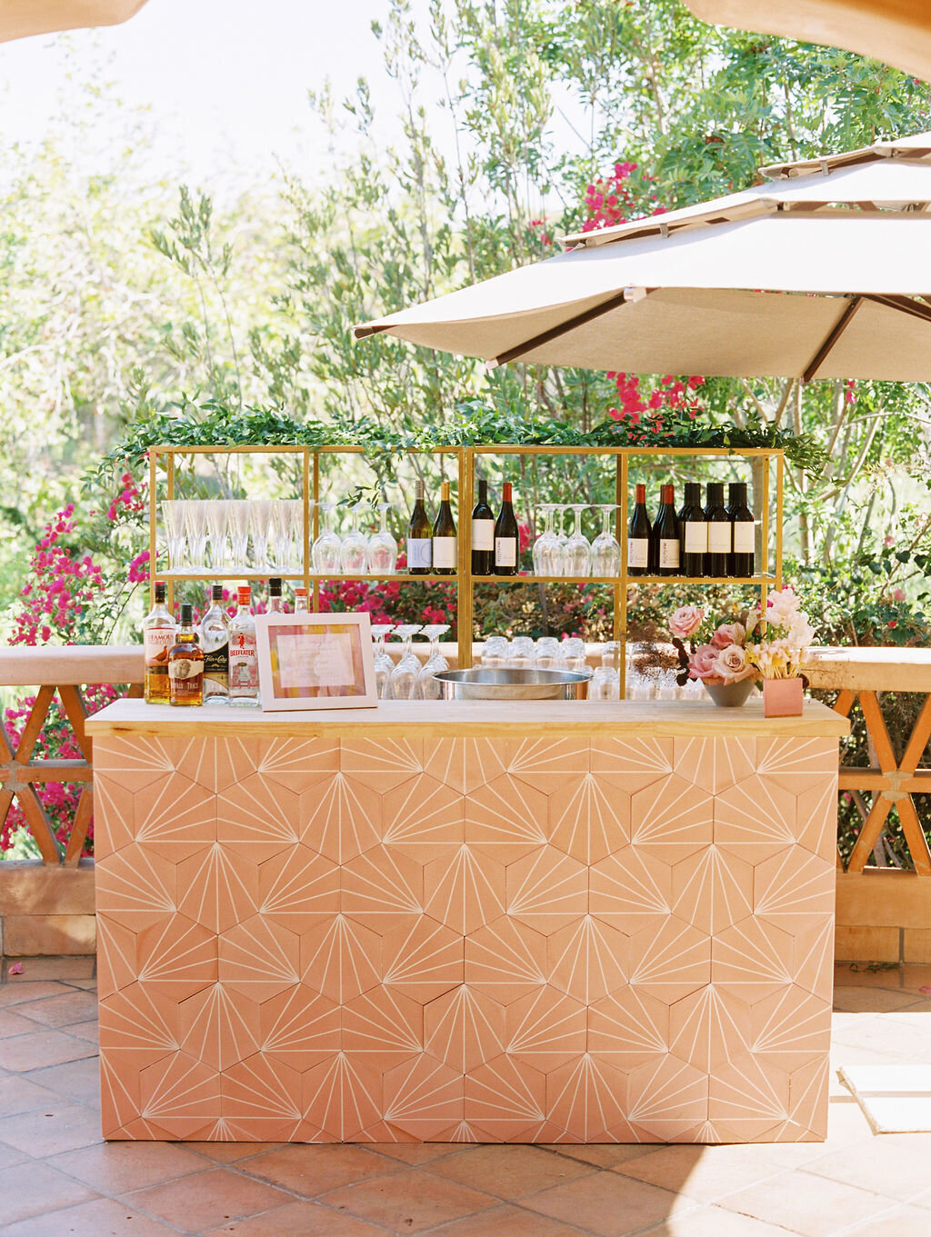Bar set up at wedding reception at at Rancho Valencia, with watercolor and lavender touches.