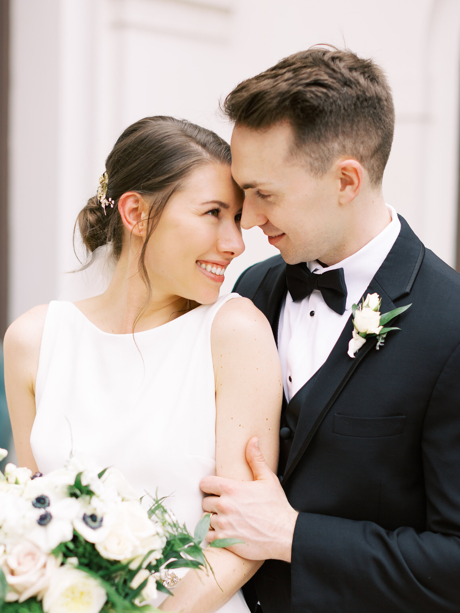 bright bridal portrait with groom going forehead to forehead