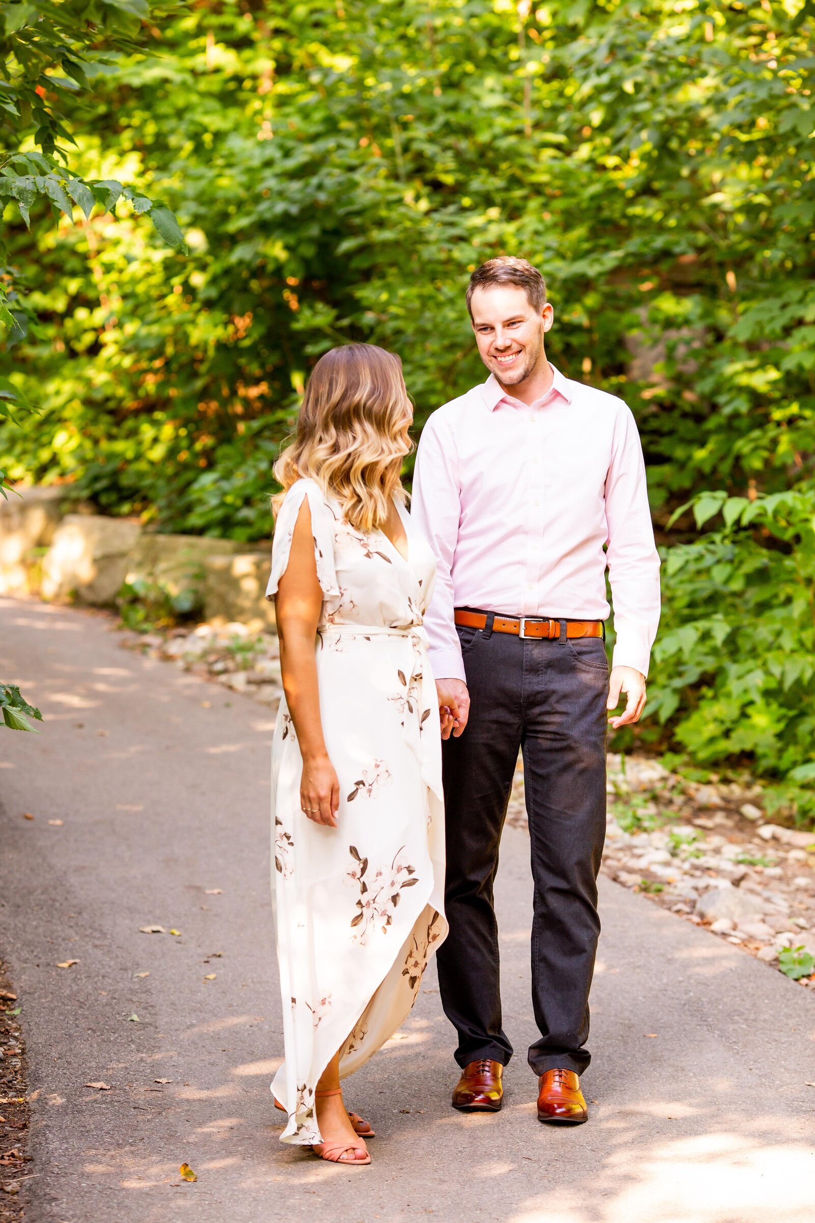 Smiling couple during engagement session at Springbank Park.