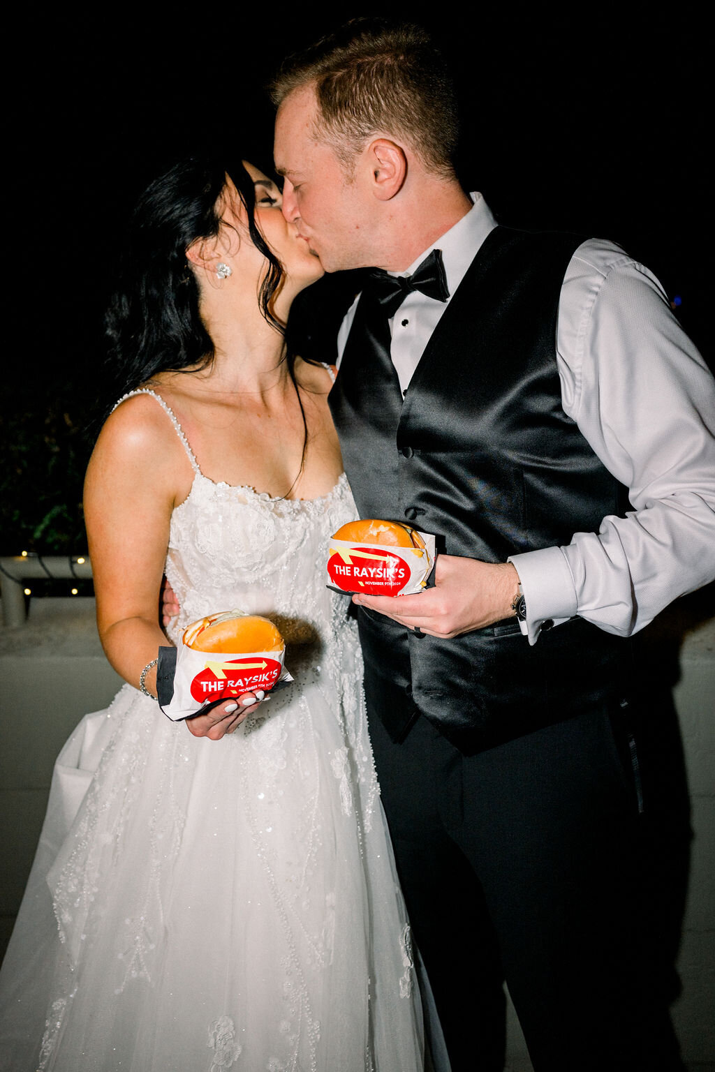 bride-groom-kiss-in-n-out-burgers-wedding-florist-phoenix