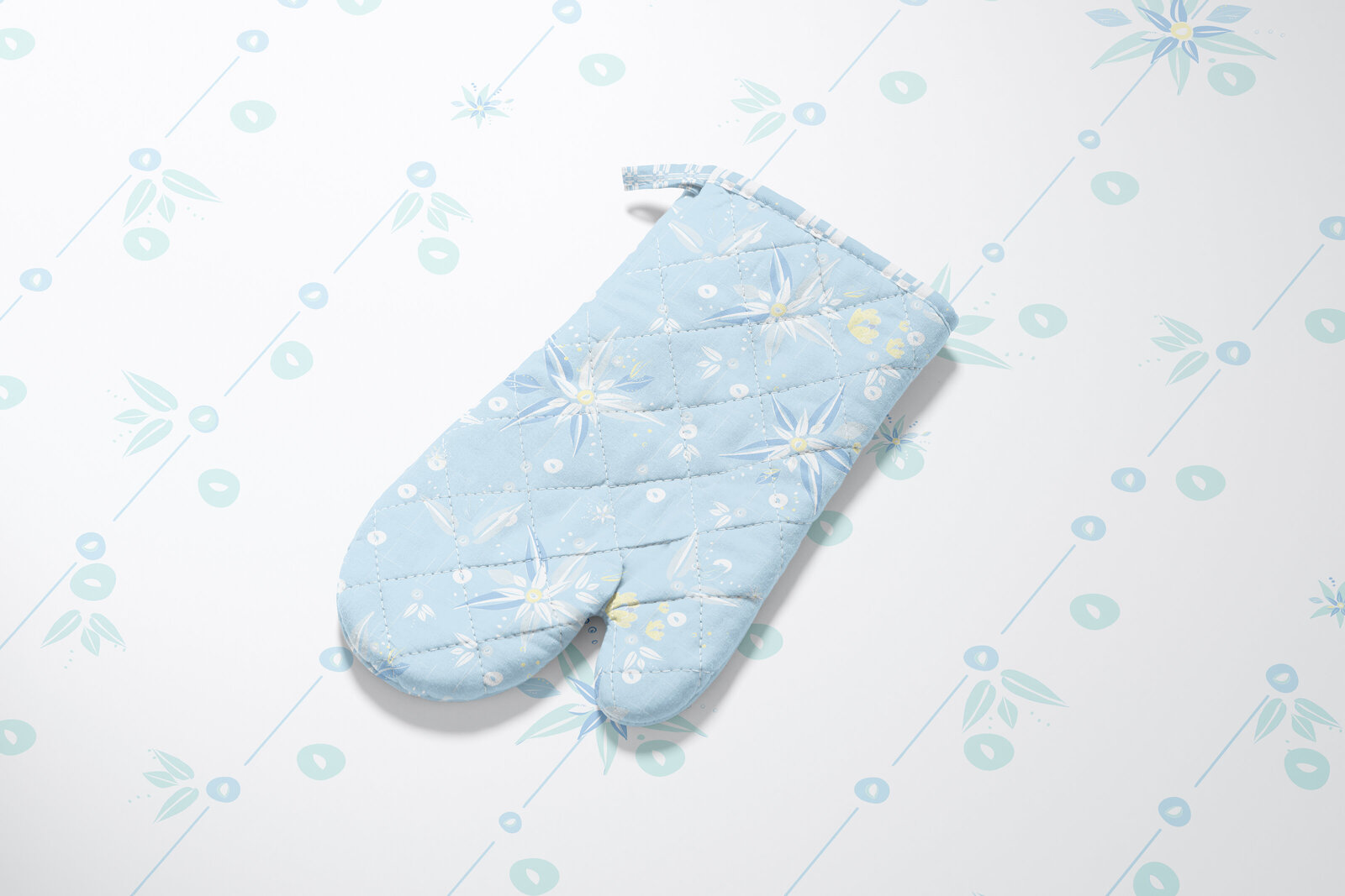 blue floral patterned fabric oven mitt