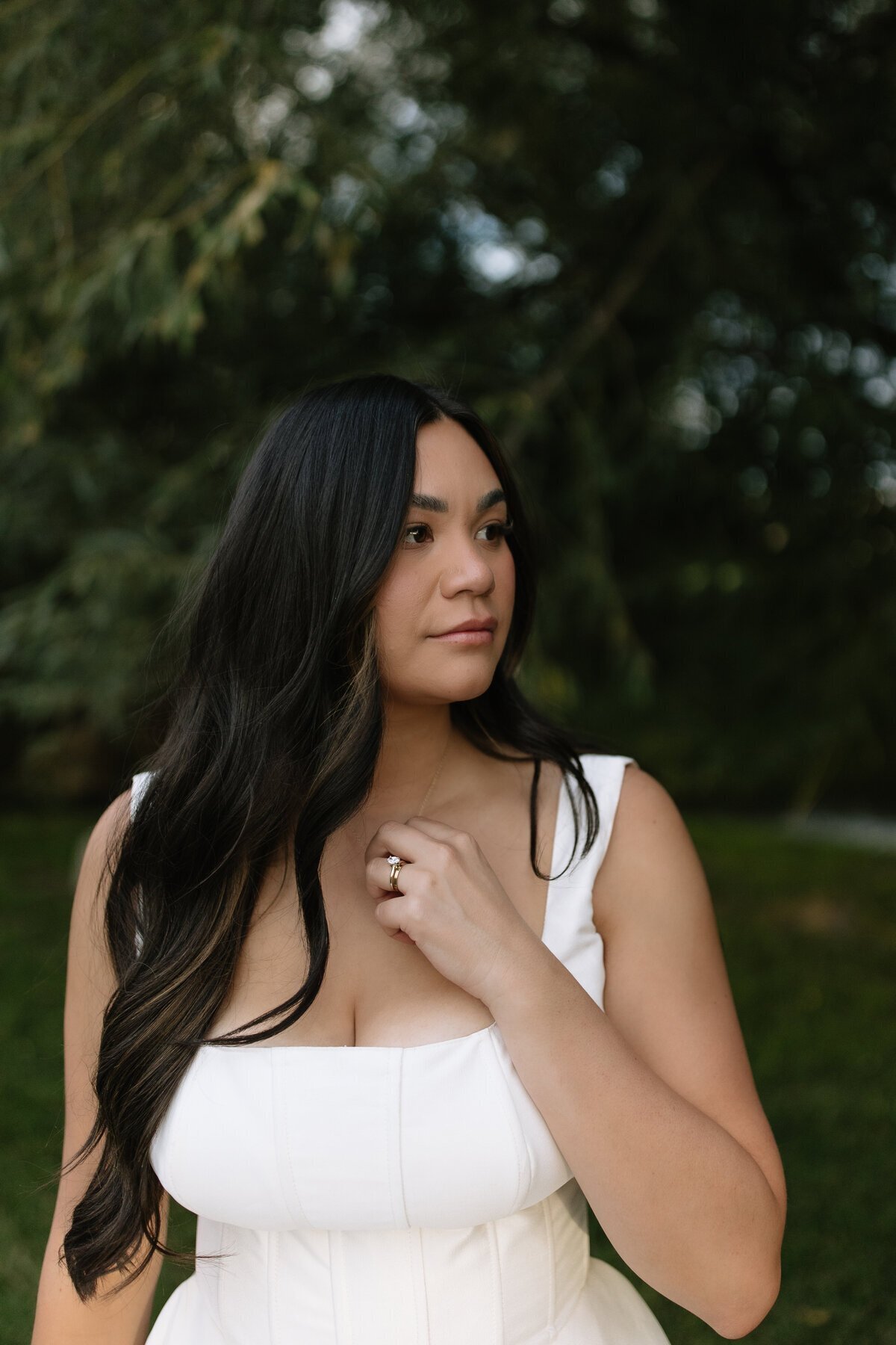 Bride holding necklace taken by destination wedding photographer Erica Rochelle Photography