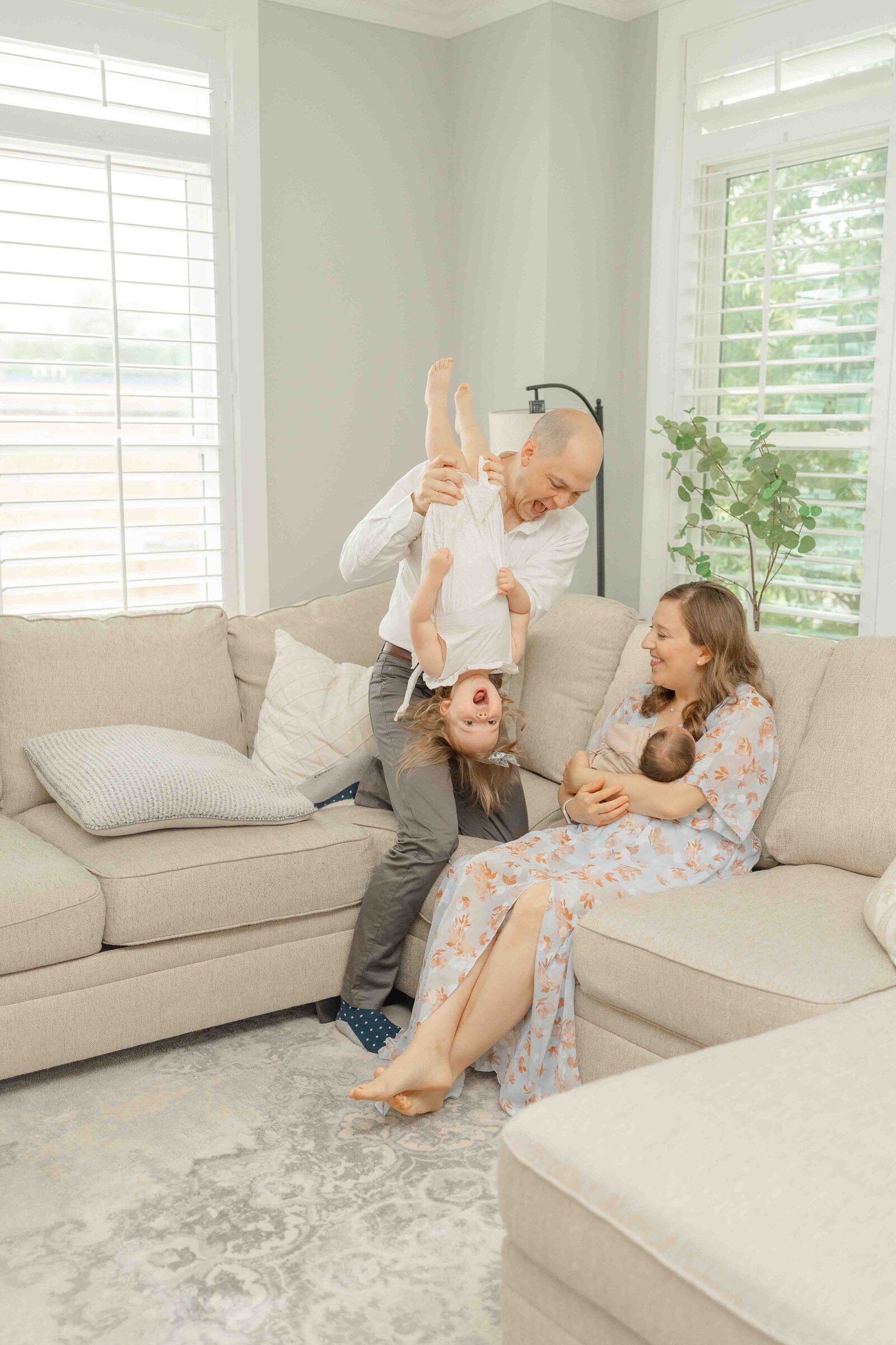 family playing during lifestyle newborn photo in Centreville, VA