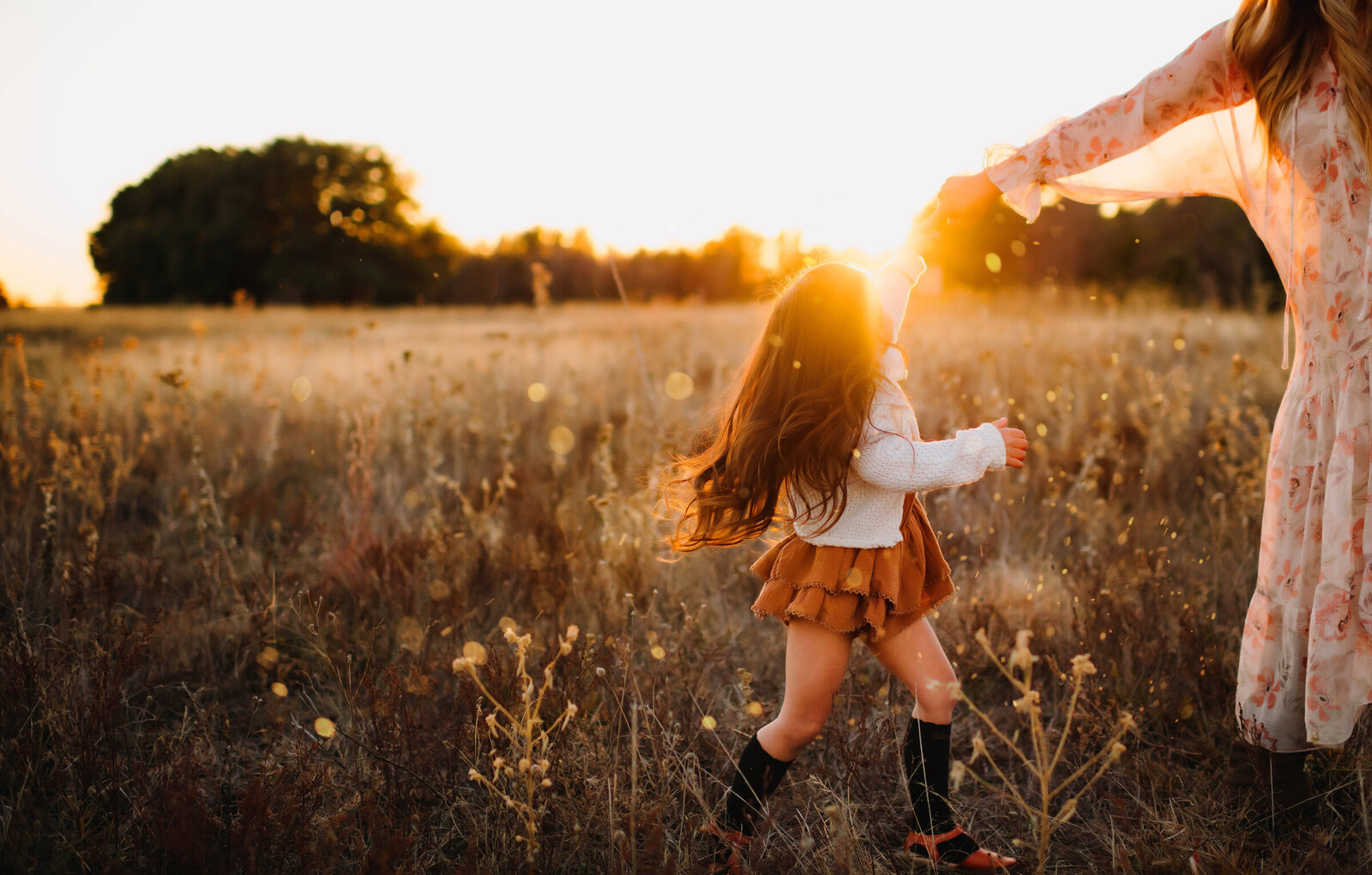 A beautiful image of Mom and Daughter taken at golden hour