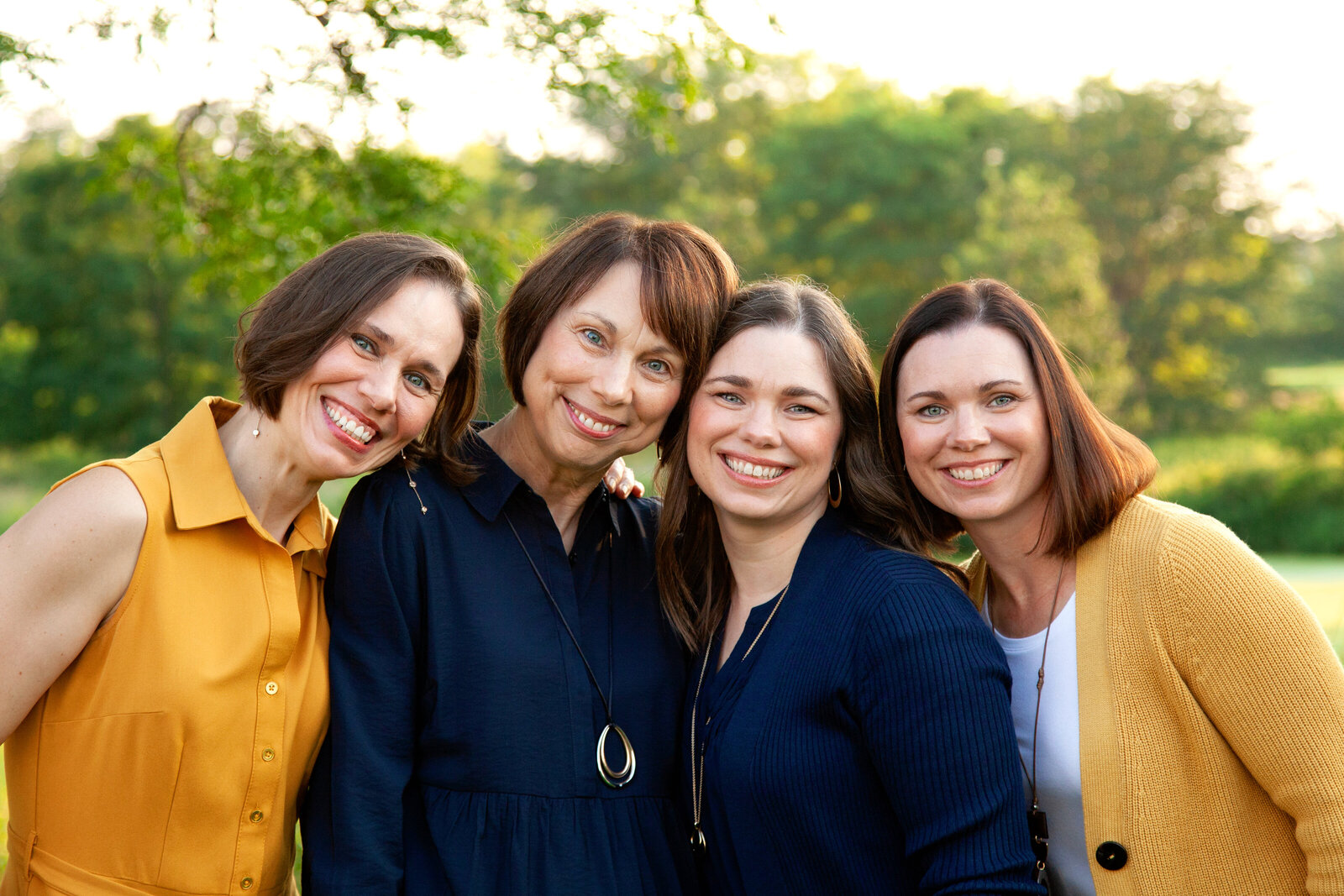 Close up of mother and three adult daughters.