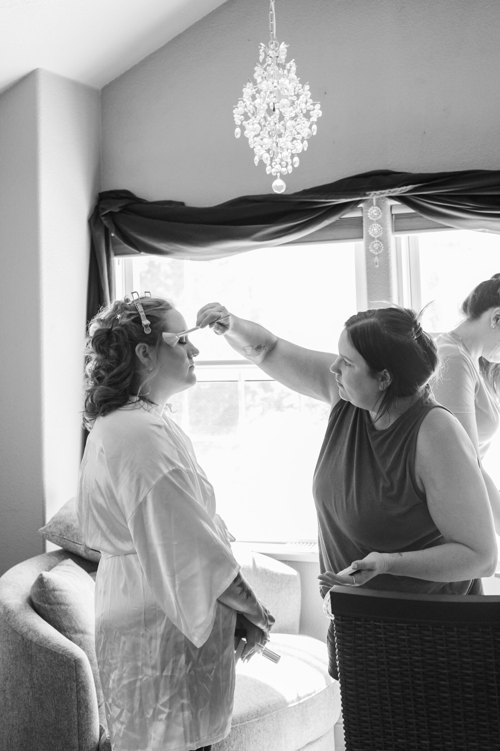 A bride with red hair and tattoos gets ready on her wedding day.
