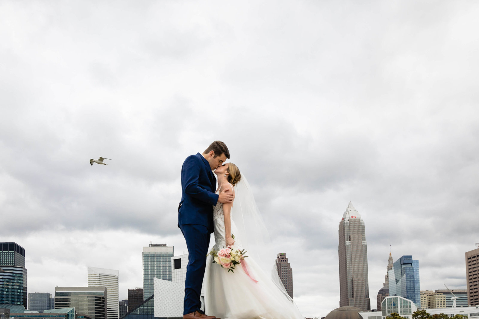 bride and groom and Cleveland skyline